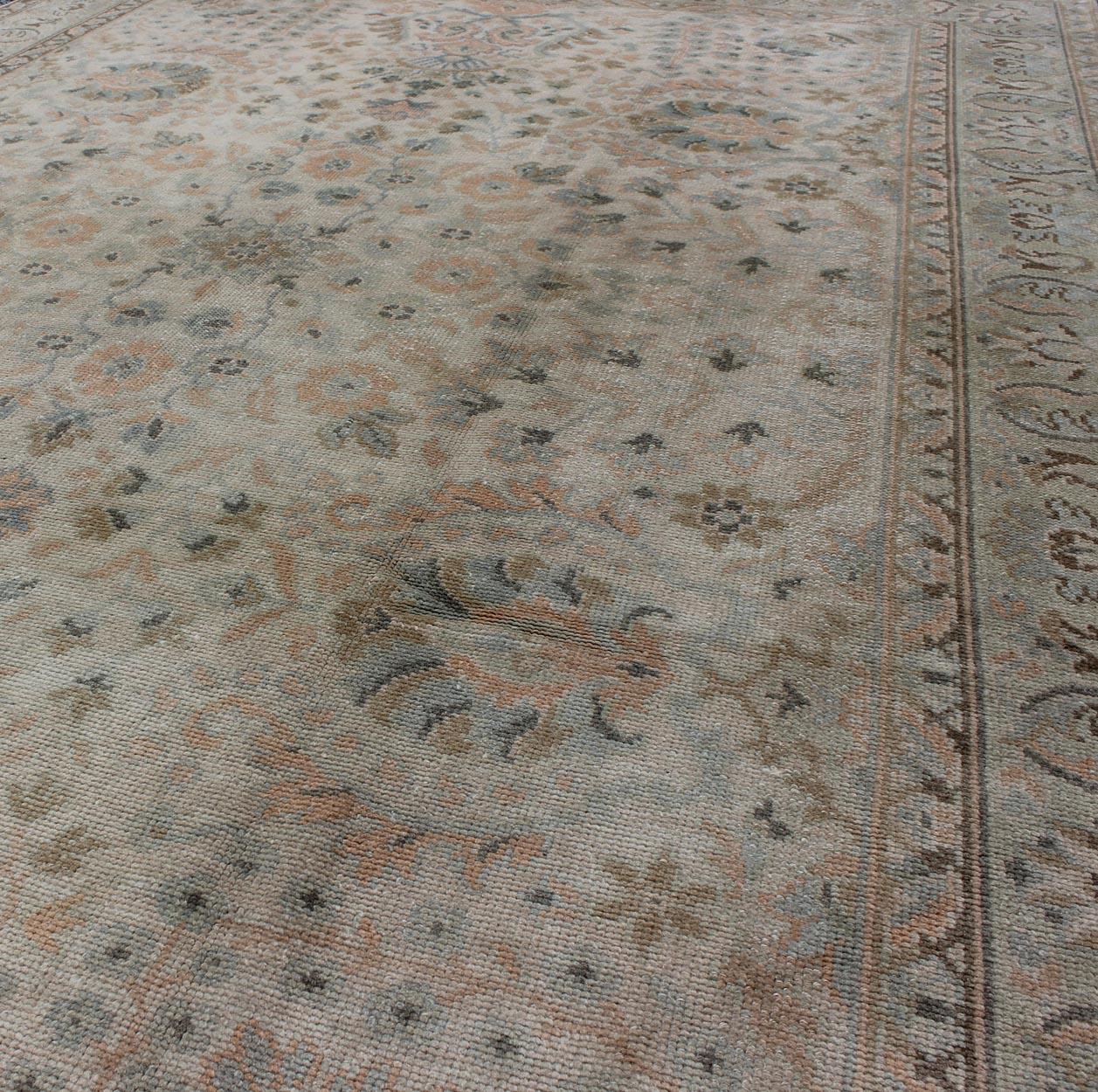 Mid-20th Century Neutral Vintage Turkish Oushak Rug with Floral Design and Repeated Floral Motifs For Sale
