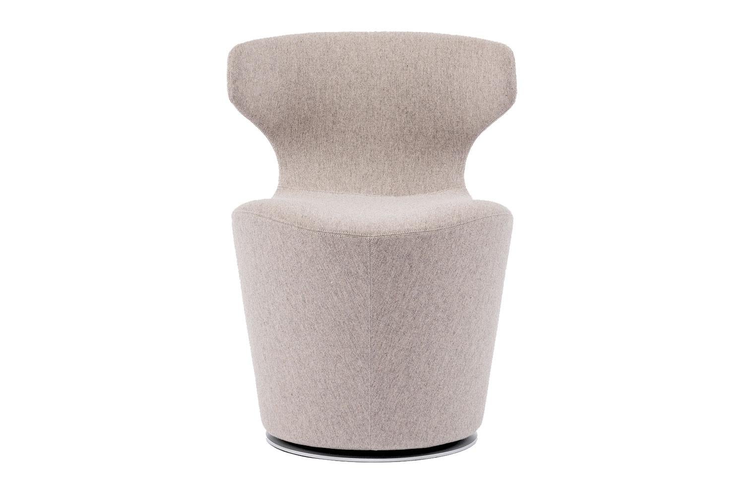 The Mini Papilio Armchair by B&B Italia is covered in a neutral warm beige wool-cashmere blend with zipper detail down the back. This armchair is suited for both residential homes and public or corporate spaces. It echoes the characteristics of the