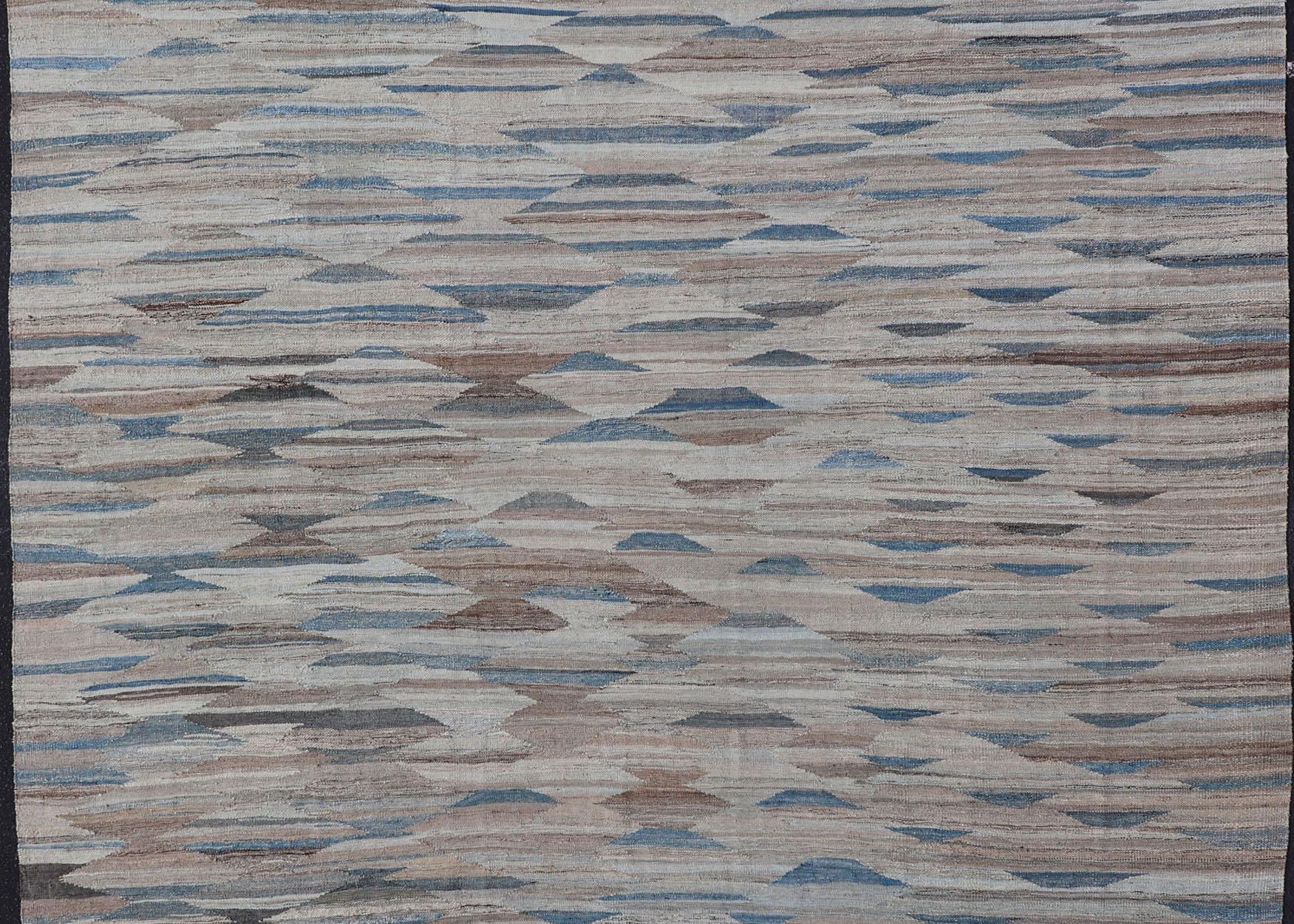 Afghan  Modern Kilim with Geometrics in  variation of Blue , Brown, Tan & Neutral Tones For Sale