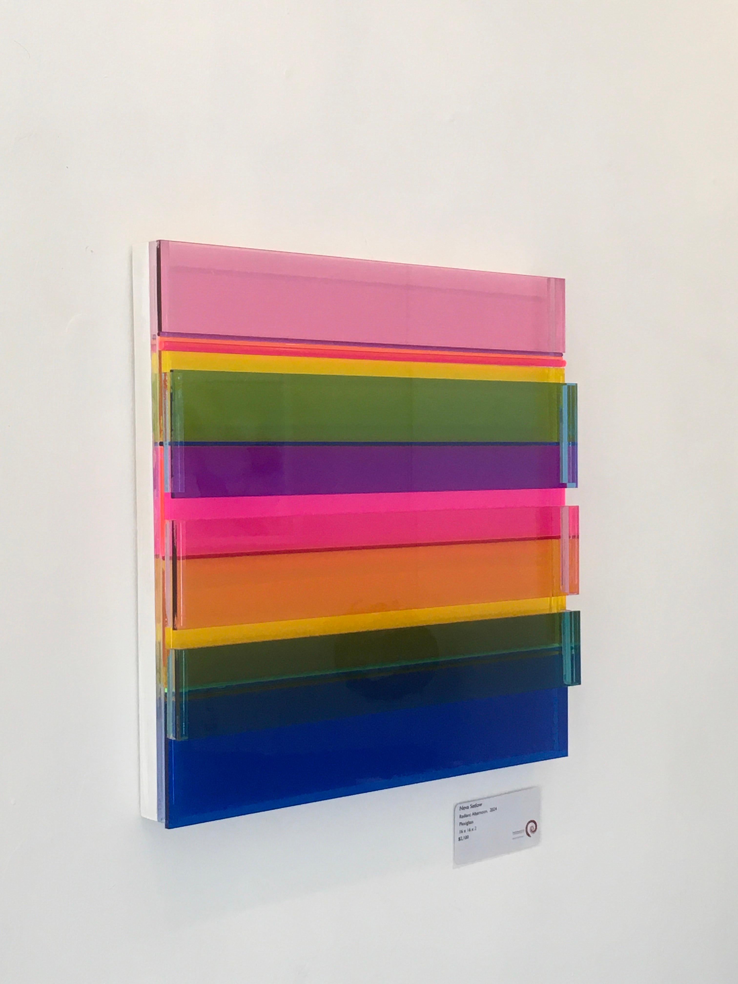 Radiant Afternoon by Neva Setlow is created with layered colored Plexiglass, both flat and round.  It is 16x16x2 created with bright colors and dimension.   It is on a wood frame and wired for easy hanging.   It is a one of a kind
