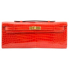 *Never Used* Hermès Kelly Cut pochette crocodile porosus lisse orange