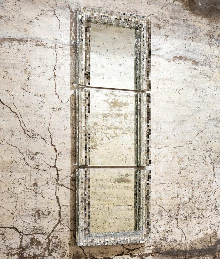 Neverend mirror by Davide Medri
Materials: mirror, glass mosaic (silver)
Also available in gold and bronze.
Dimensions: D 7 x W 70 x H 210 cm

Davide Medri was born in Cesena on August 7th 1967 and graduated at the Academy of Fine Arts in