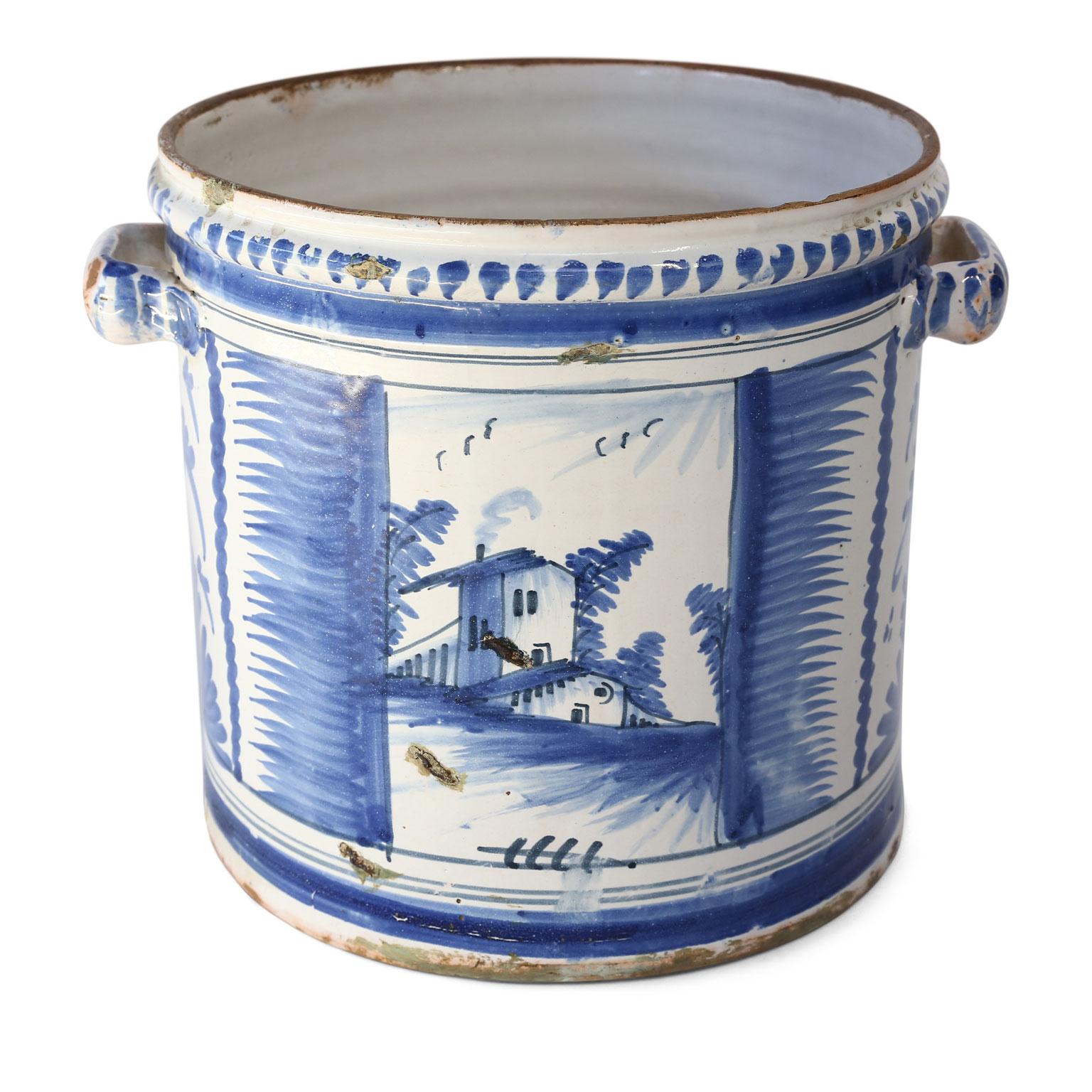 Nevers Faience 'Pot a Oranger' adorned with painted farmhouse scenes and scrolled decoration in shades of blue (camaieu bleu). This circa 1750-1780 tin-glazed planter comes from Nevers, France, an important site of faience production in the 18th