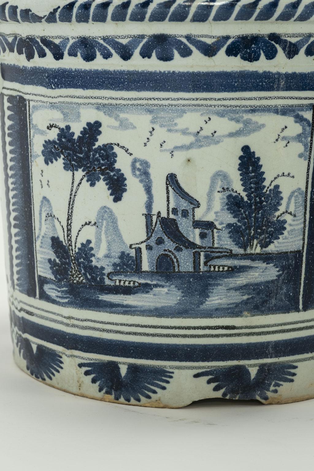Nevers Faience 'Pot a Oranger' adorned with painted farmhouse scenes and scrolled decoration in shades of blue (camaieu bleu). This circa 1780-1800 tin-glazed planter comes from Nevers, France, an important site of faience production in the 18th
