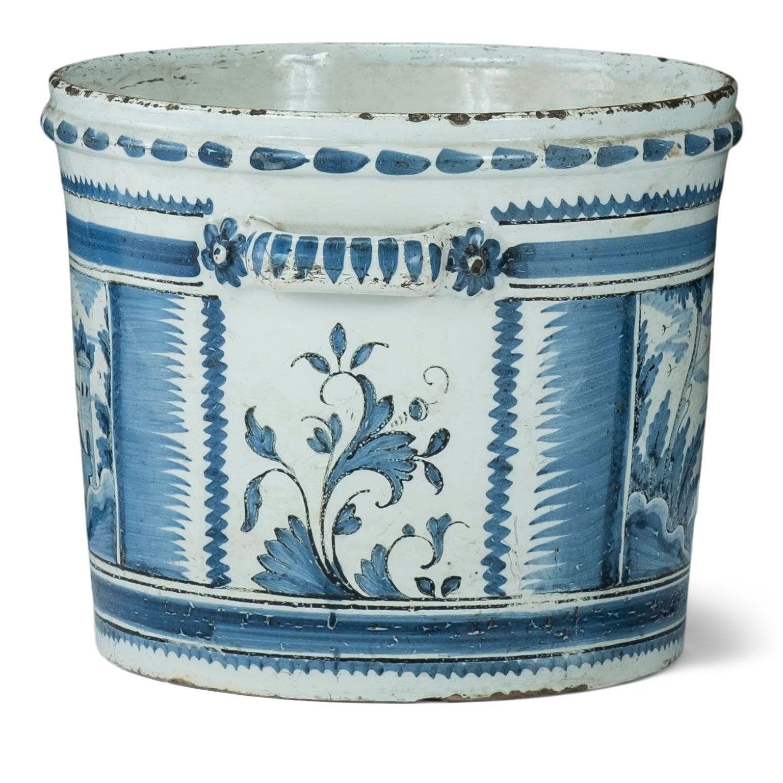 Nevers Faience 'Pot a Oranger' adorned with painted farmhouse scenes and scrolled decoration in shades of blue (camaieu bleu). This circa 1780-1800 tin-glazed planter comes from Nevers, France, an important site of faience production in the 18th