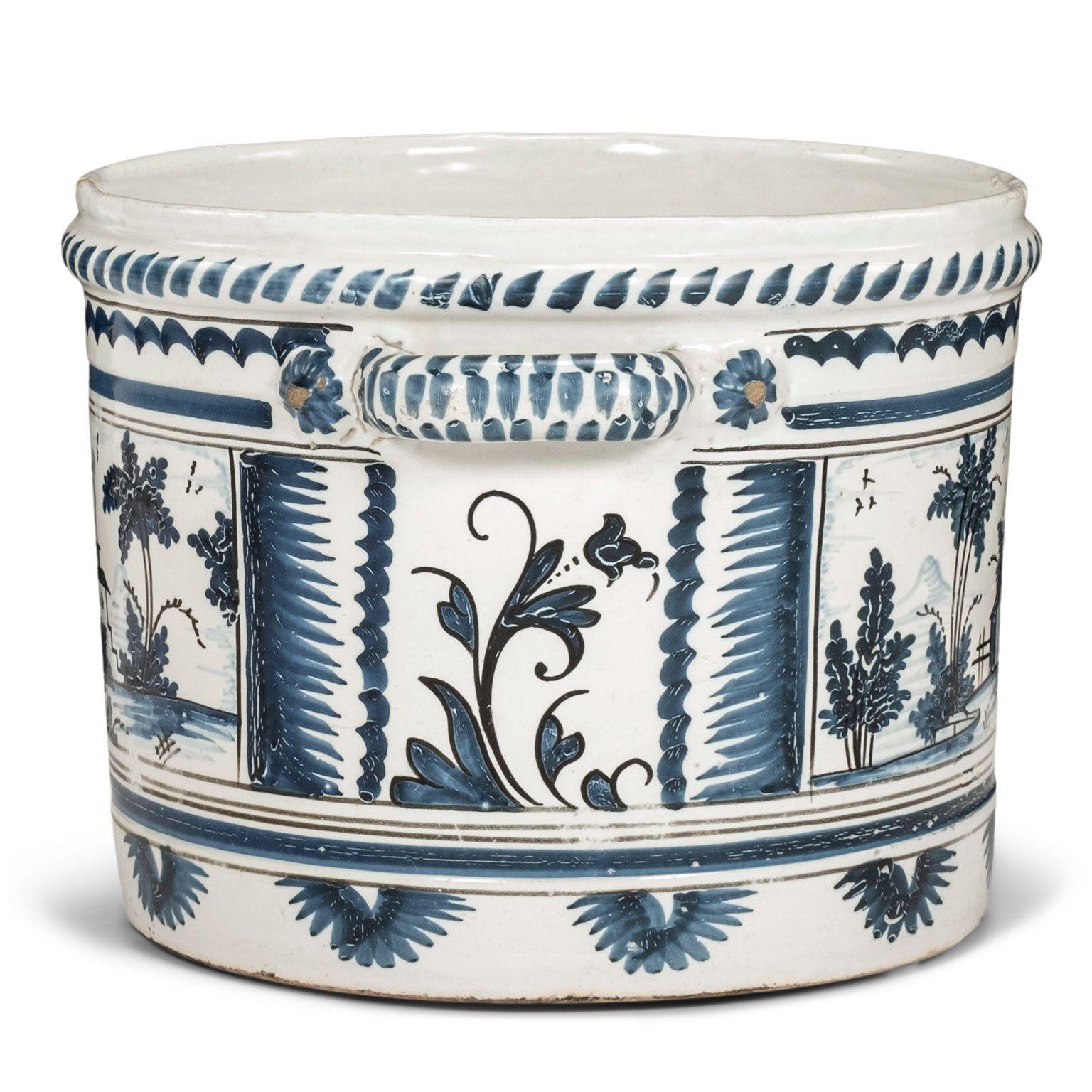 Nevers Faience 'Pot a Oranger' adorned with painted farmhouse scenes and scrolled decoration in shades of blue (camaieu bleu). This circa 1750-1780 tin-glazed planter comes from Nevers, France, an important site of faience production in the 18th
