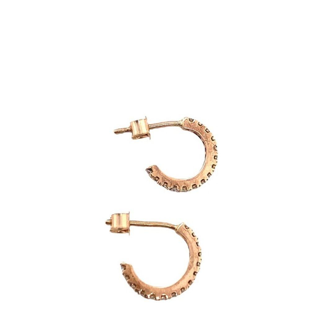 New 9ct Rose Gold Mini Hoop Earrings Set with 0.10ct of Total Diamonds

Additional Information:
Set with 15 Diamonds in Each Earring.
Total Diamond Weight: 0.10ct
Diamond Colour: G/H
Diamond Clarity: Si
Total Weight: 0.7g 
Earrings Internal