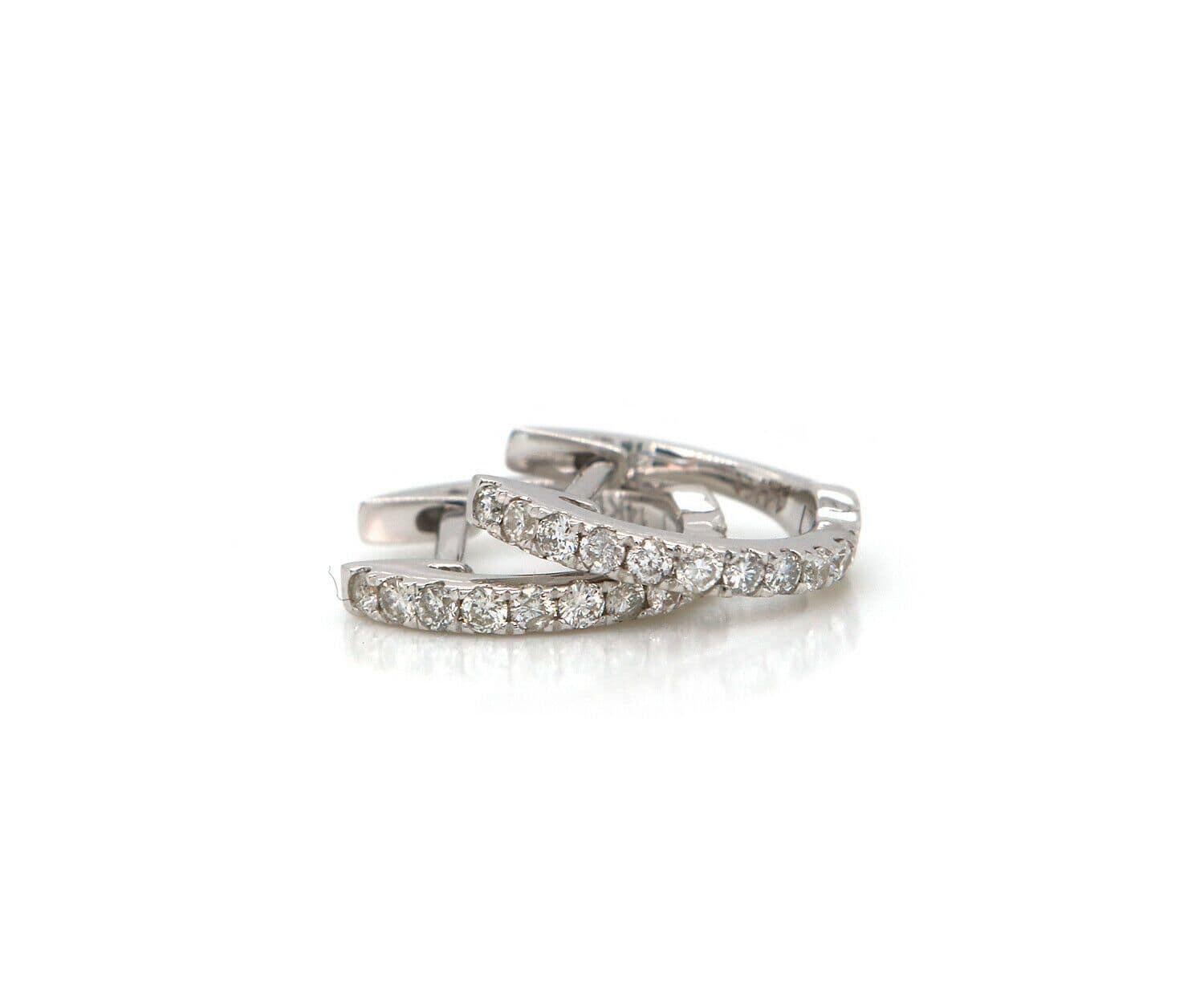 New 0.22ctw Diamond Petite Huggie Earrings in 14K

Diamond Petite Huggie Earrings
14K White Gold
Diamonds Carat Weight: Approx. 0.22ctw
Earring Dimensions: Approx. 8.0 X 12.0 MM
Weight: Approx. 1.20 Grams
Stamped: 14KT

Condition:
Offered for your