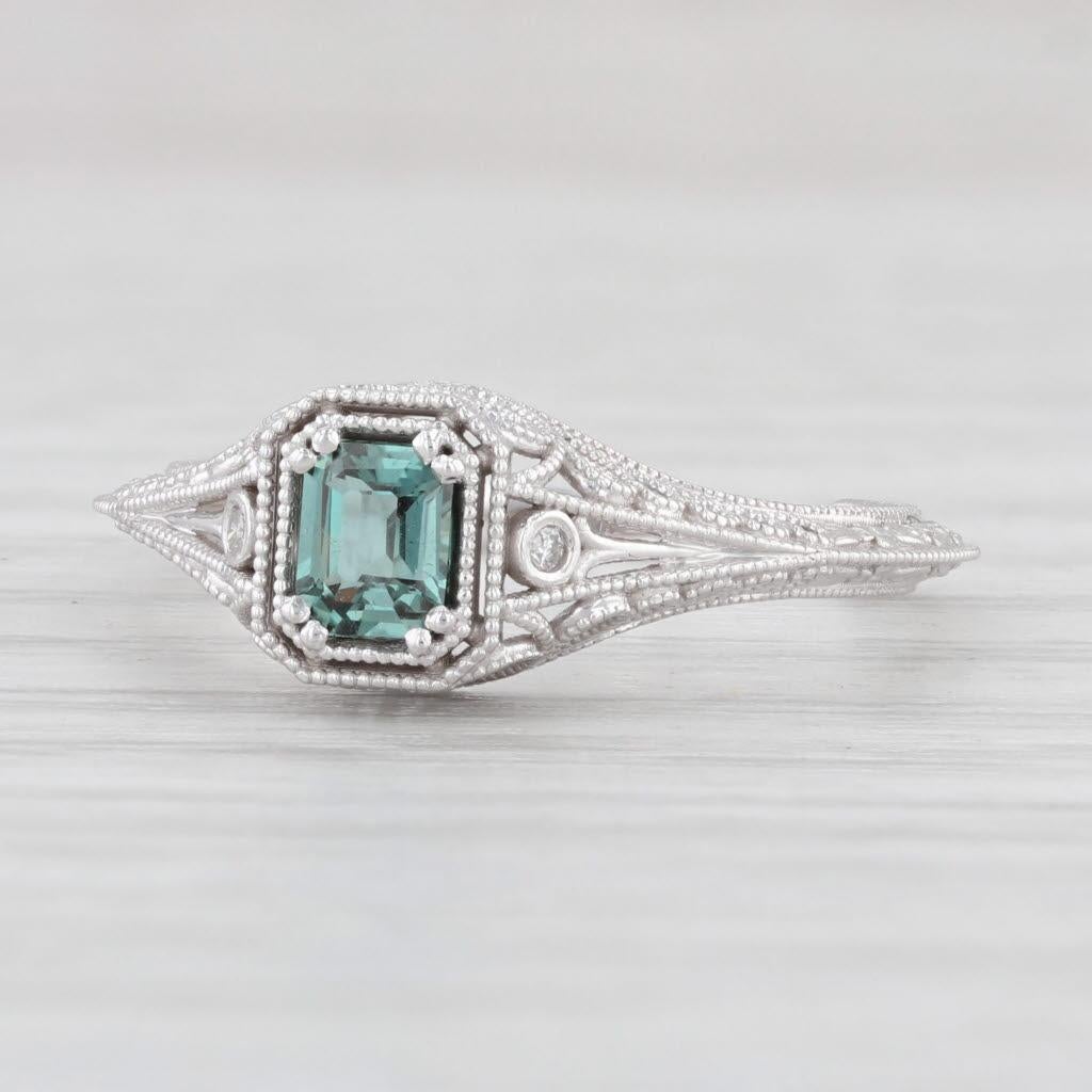 Gemstone Information:
*Natural Alexandrite*
Total Carats - 0.30ct
Cut - Emerald
Color - Dark Green

Metal: 14k White Gold
Weight: 1.8 Grams 
Stamps: 14k
Face Height: 6.9 mm 
Rise Above Finger: 5.6 mm
Band / Shank Width: 1.5 mm

This ring is a size 6