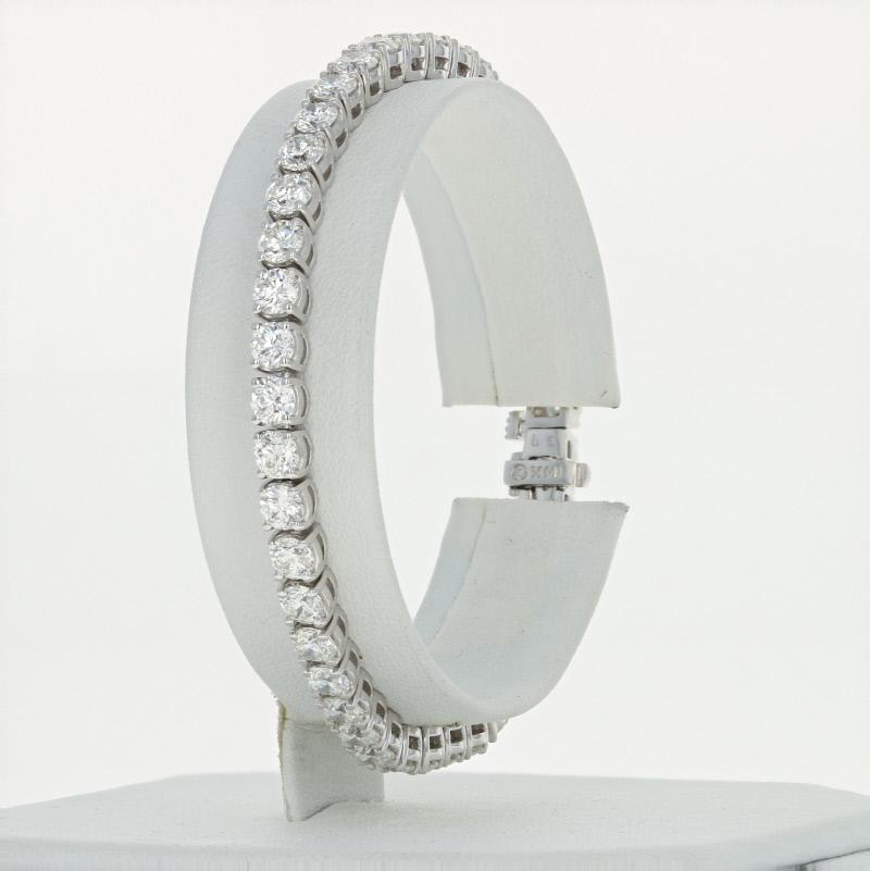 Exquisite beauty and timeless design unite to create this red carpet-worthy piece! Composed of glistening 14k white gold, this NEW bracelet is fashioned in a classic tennis style and showcases a magnificent array of white diamonds that will light up