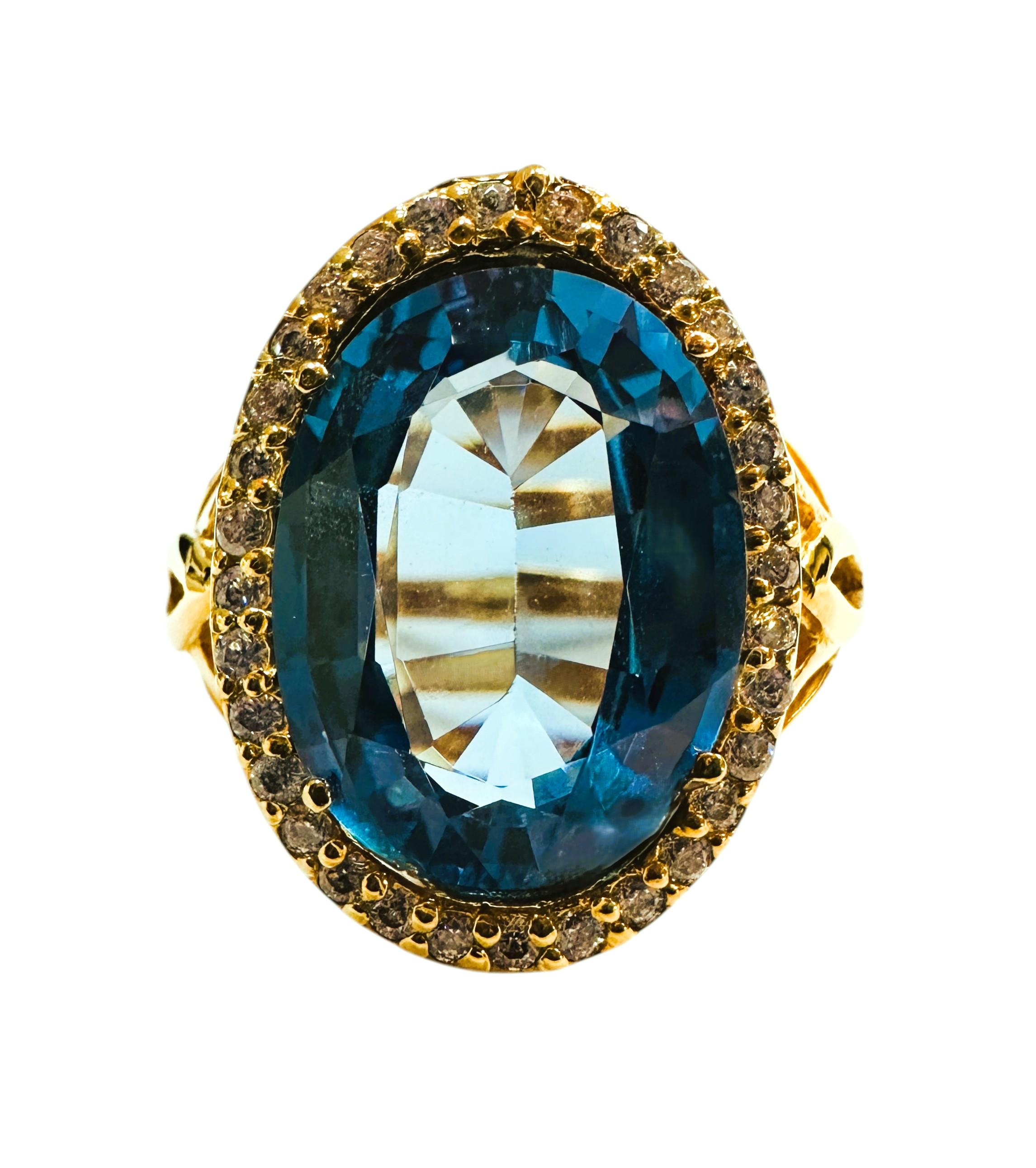 The stone is from Africa and is just exquisite. The stone is a Blue Topaz and is 12.25 carats.  The stone is a fancy oval cut stone and measures 12.5 x 10 mm and is surrounded by diamond cut white sapphires.  They are all placed in a beautiful