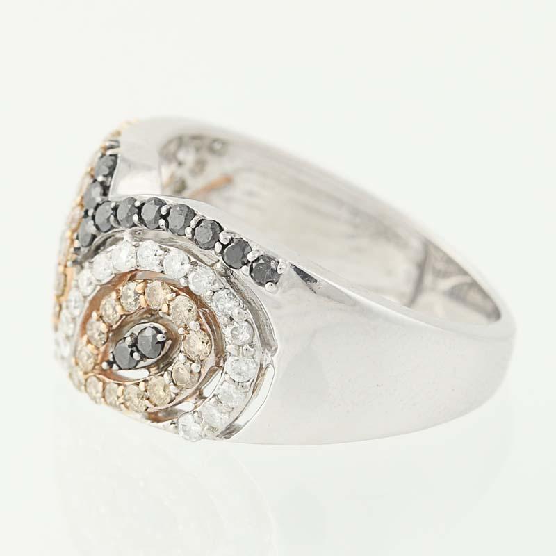 Bold and beautiful, this ring will add an exotic touch to any outfit in your wardrobe. This NEW piece is fashioned in two types of 14k gold and features a paisley-inspired, open-cut design outlined in white, black, and champagne-hued diamonds. Open