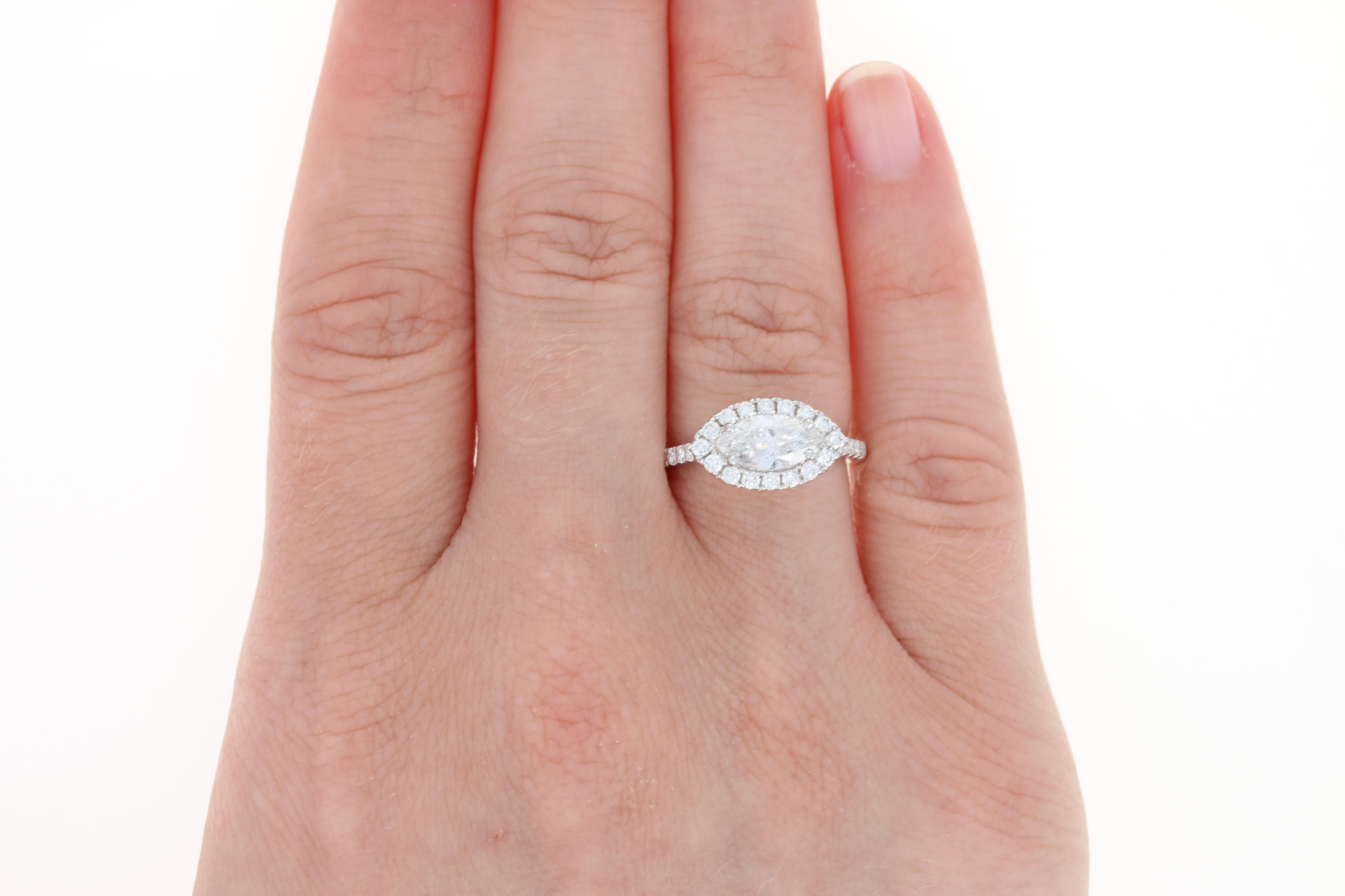 Celebrate your fairy tale love story with this exquisite NEW engagement ring and wedding band! Showcasing a halo-style design, this 14k white gold bridal set is illuminated by the engagement ring’s GIA-graded marquise diamond solitaire and the