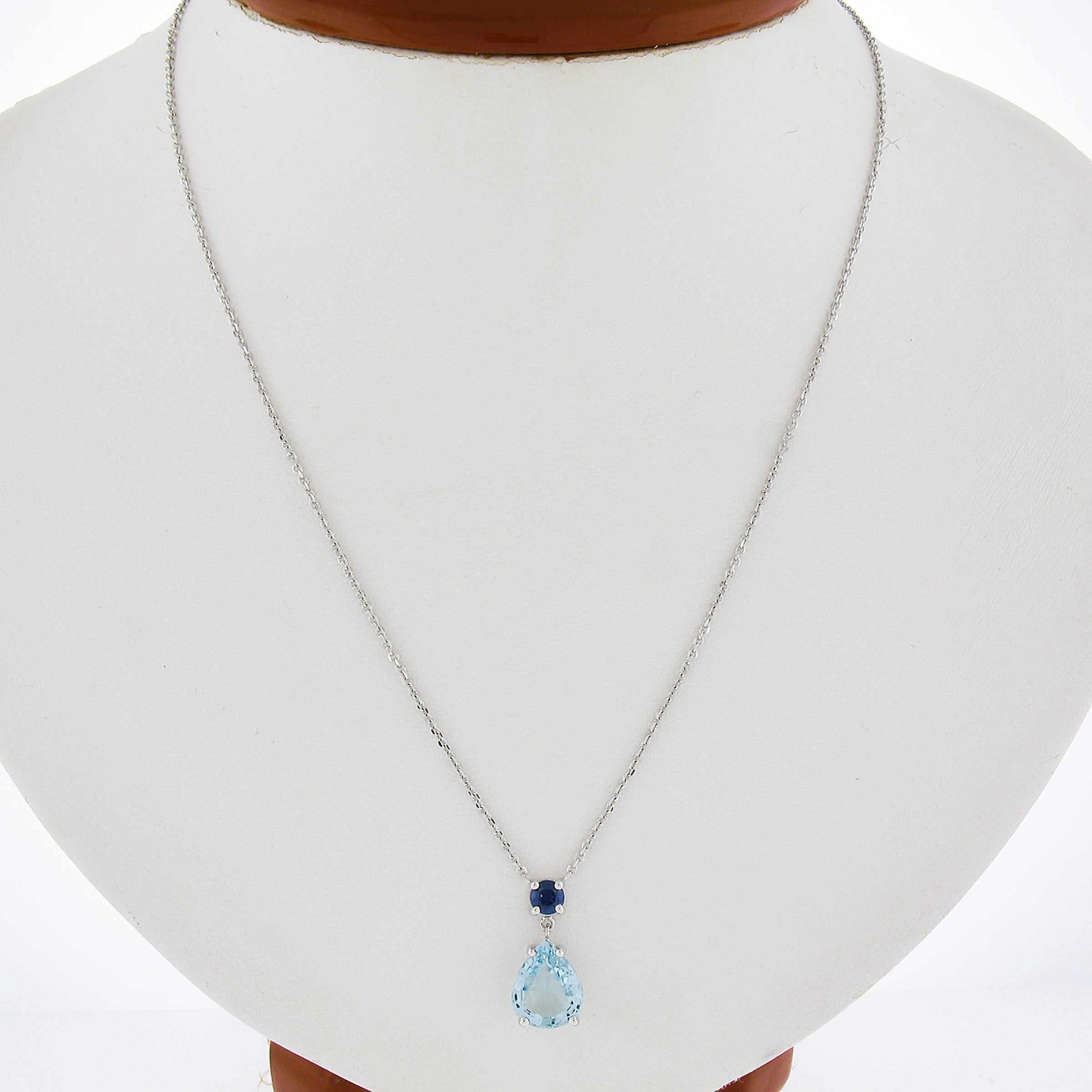 Fantastic Contrast of Blues! Very wearable necklace with a simple elegant design. The Aquamarine stands out and the sapphire adds a touch that makes this piece standout! Enjoy!

--Stone(s):--
(1) Natural Genuine Aquamarine - Pear Cut - Prong Set -
