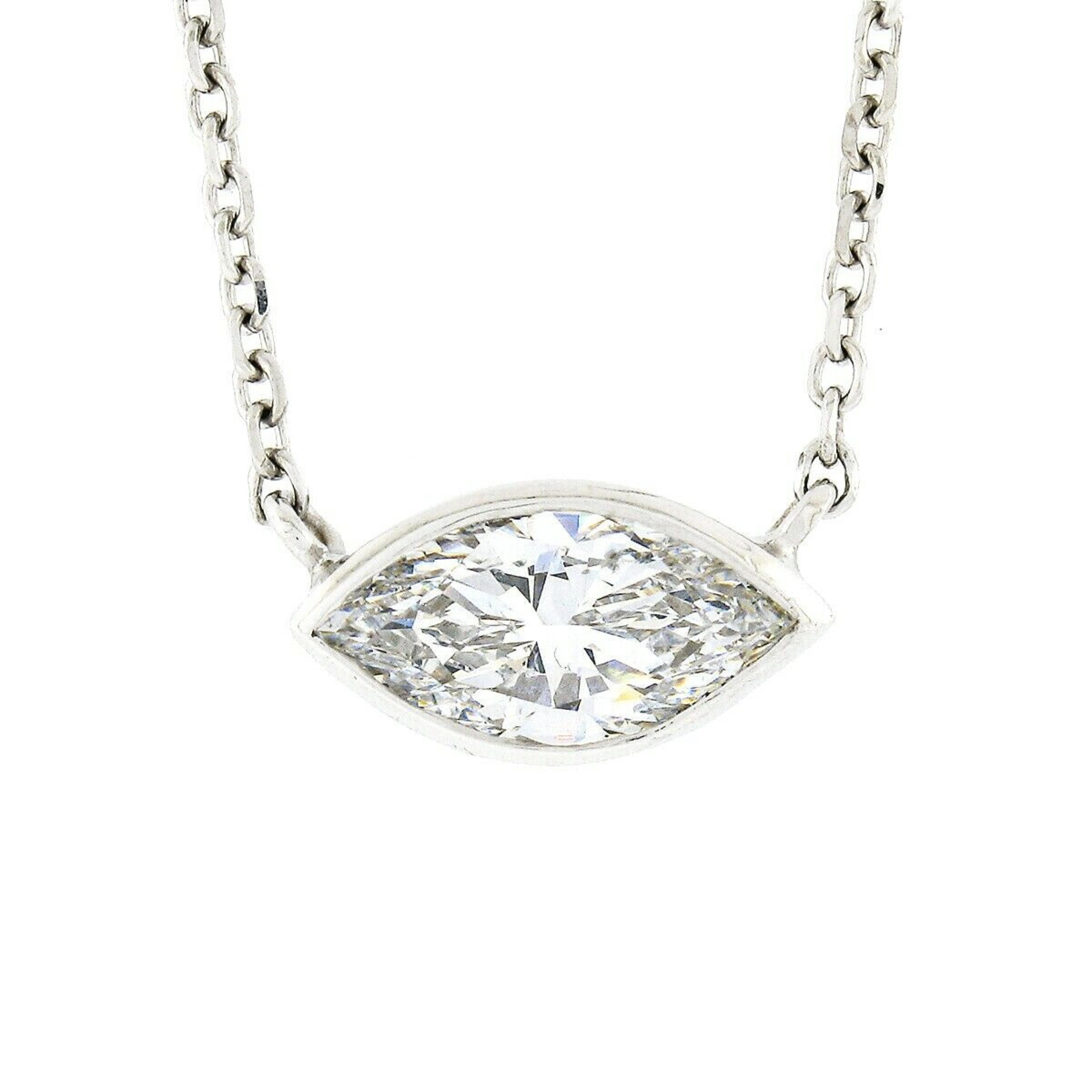 Here we have a gorgeous, brand new, pendant necklace crafted in solid 14k white gold. The necklace features a fine, GIA certified, marquise brilliant cut diamond solitaire neatly bezel set at the center of an adjustable 18.5 or 16.5 inch cable link