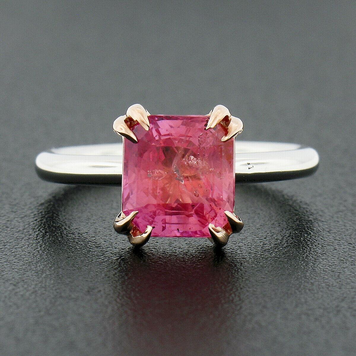 You are looking at an incredible and super rare Padparadscha sapphire solitaire ring, that is custom designed and newly crafted in solid platinum with a 14k rose gold head. The magnificent, AGL certified, sapphire is neatly and professionally dual