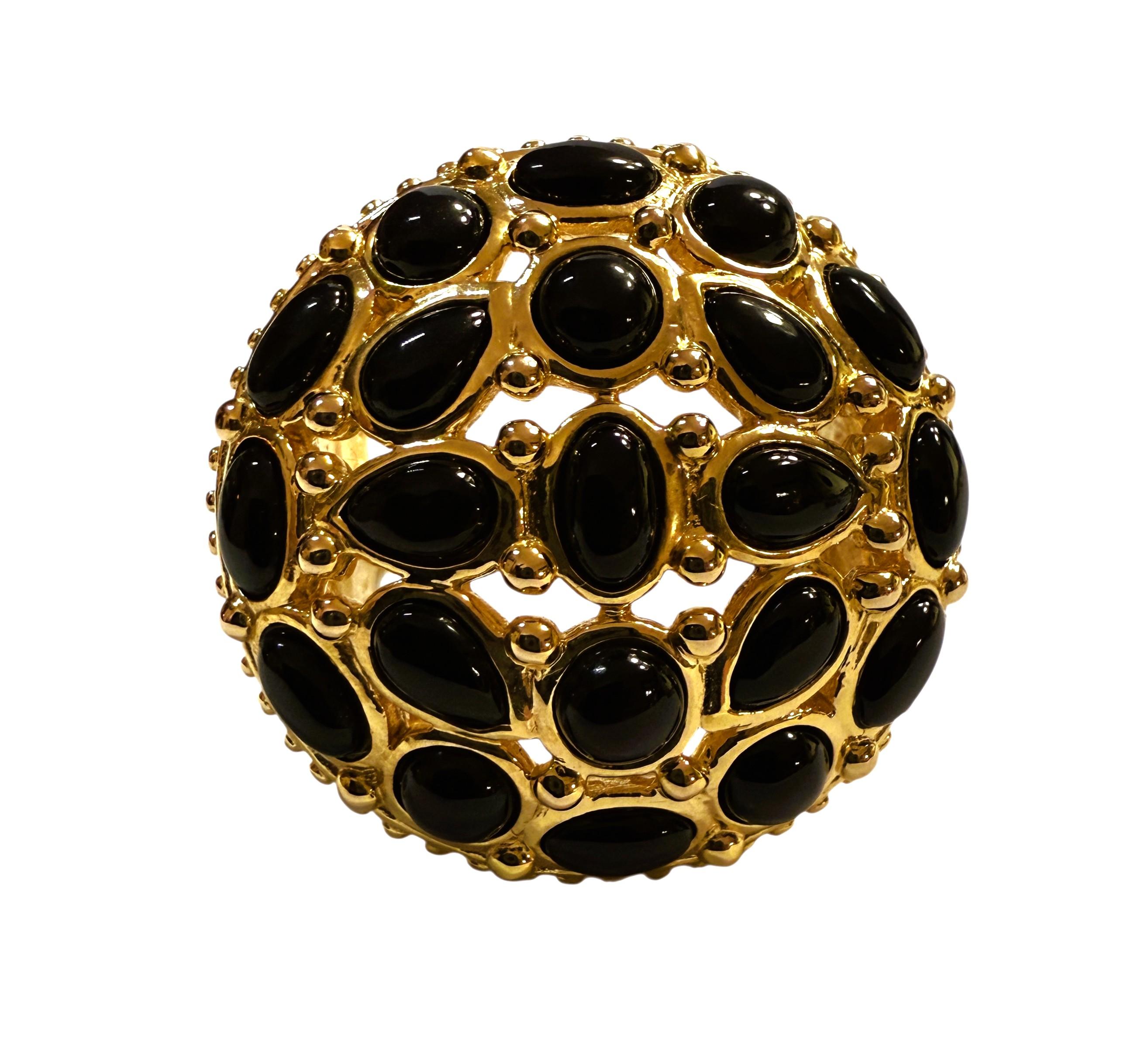 What a gorgeous and unique ring this is!!   I just love the design it has and it is so comfortable on the finger.  I has 21 pieces of various shaped black onyx stones.  Some are pear shaped, some oval shaped and some round.  The face of the ring is