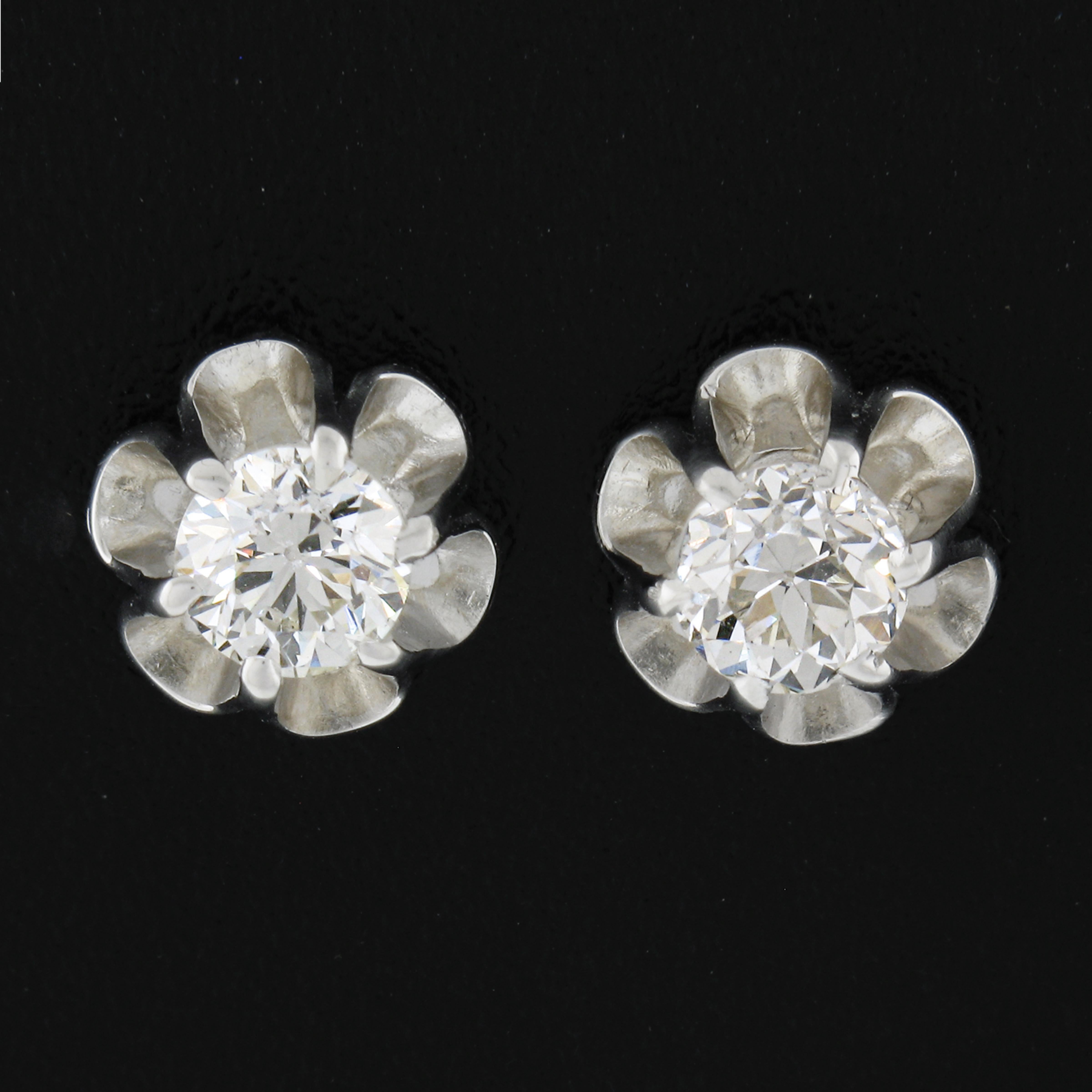 These gorgeous stud earrings are crafted in solid 14k white gold and feature old European cut diamonds that are elegantly set in brand new buttercup prong basket settings. The stunning and very fiery diamonds total 0.76 carats in weight and are