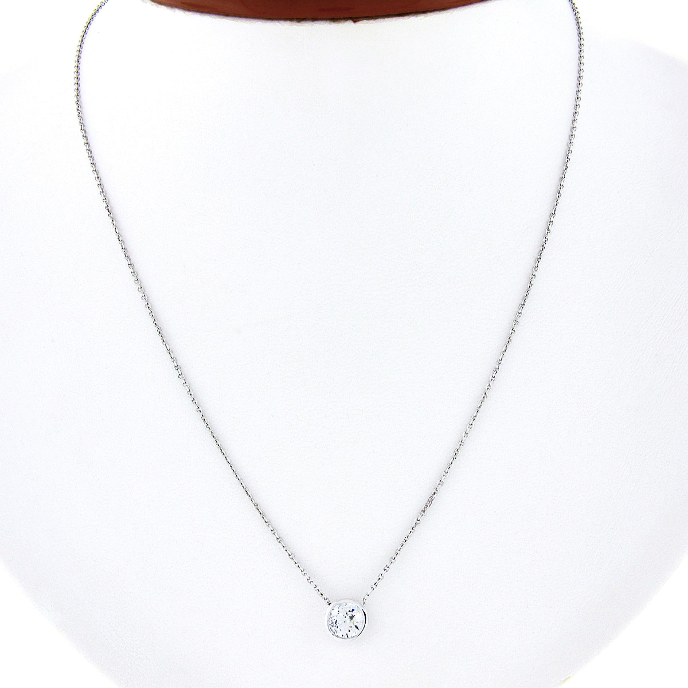 You are looking at a stunning and classically styled diamond solitaire pendant that is newly crafted in solid 14k white gold. The large and fiery diamond on this pendant is outstandingly brilliant having near colorless G color, SI2 clarity, and