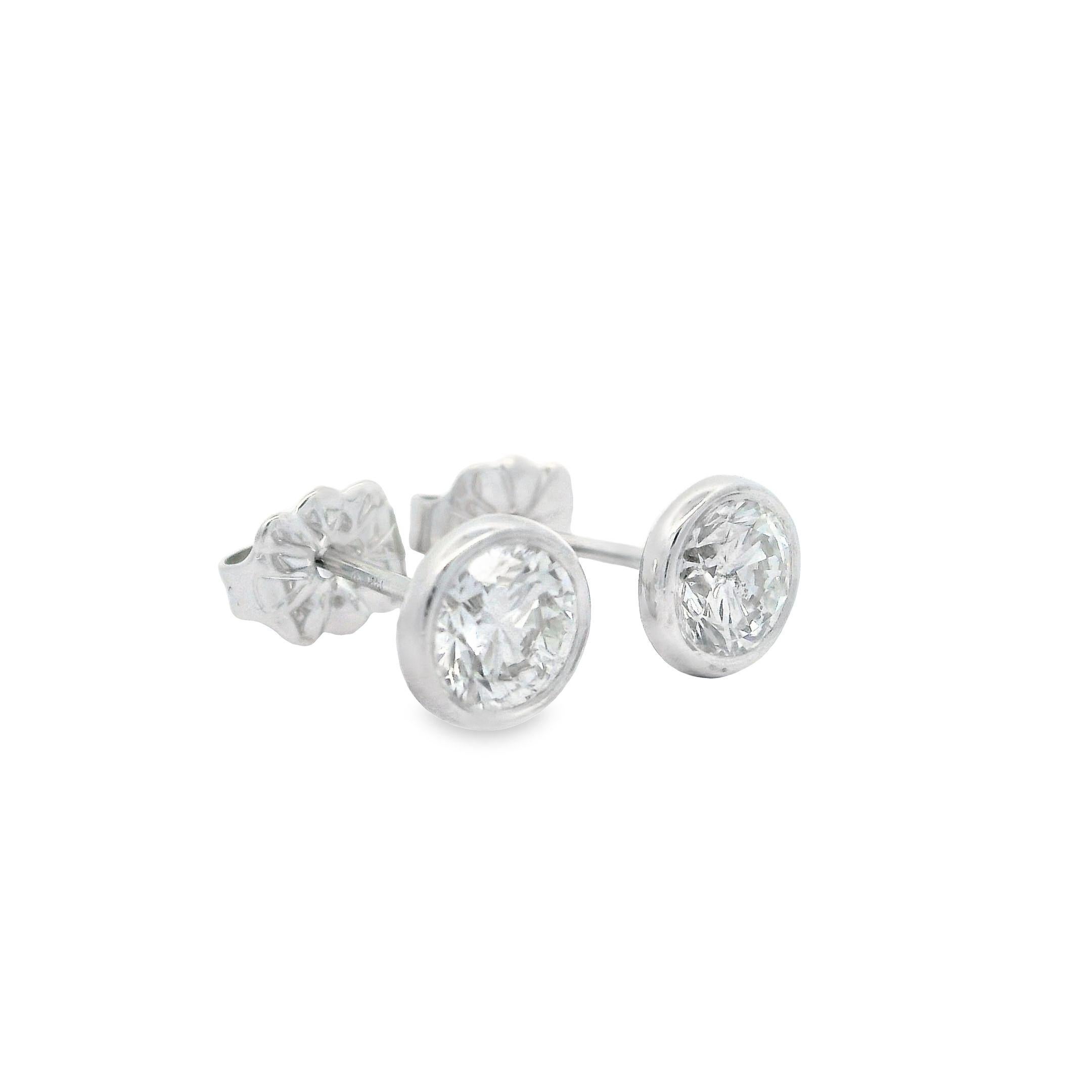 –Stone(s)–
(2) Natural Genuine Diamonds - Round Brilliant Cut - Martini Bezel Set - G/H Color - VS1-SI1 Clarity - 1.01ctw (exact)

Material: Solid 14k White Gold
Weight: 1.09 Grams
Backing: Post w/ Butterfly Clasp (Pierced ears are