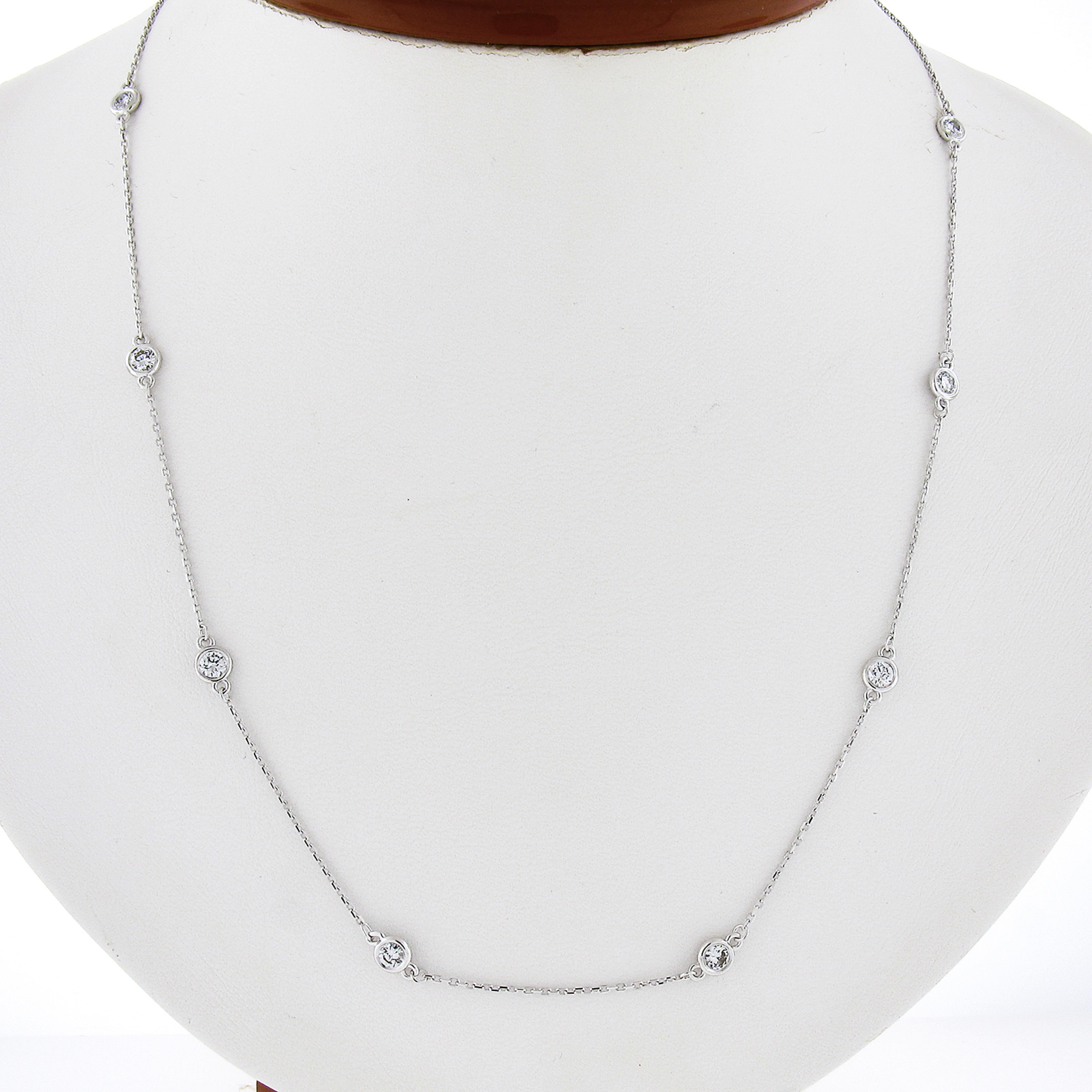 This classic diamond by the yard necklace is newly crafted in solid 14k white gold and features cable link chain with 10 bezel settings that carry the stunning diamonds along the necklace. The diamonds are round brilliant cut and total approximately