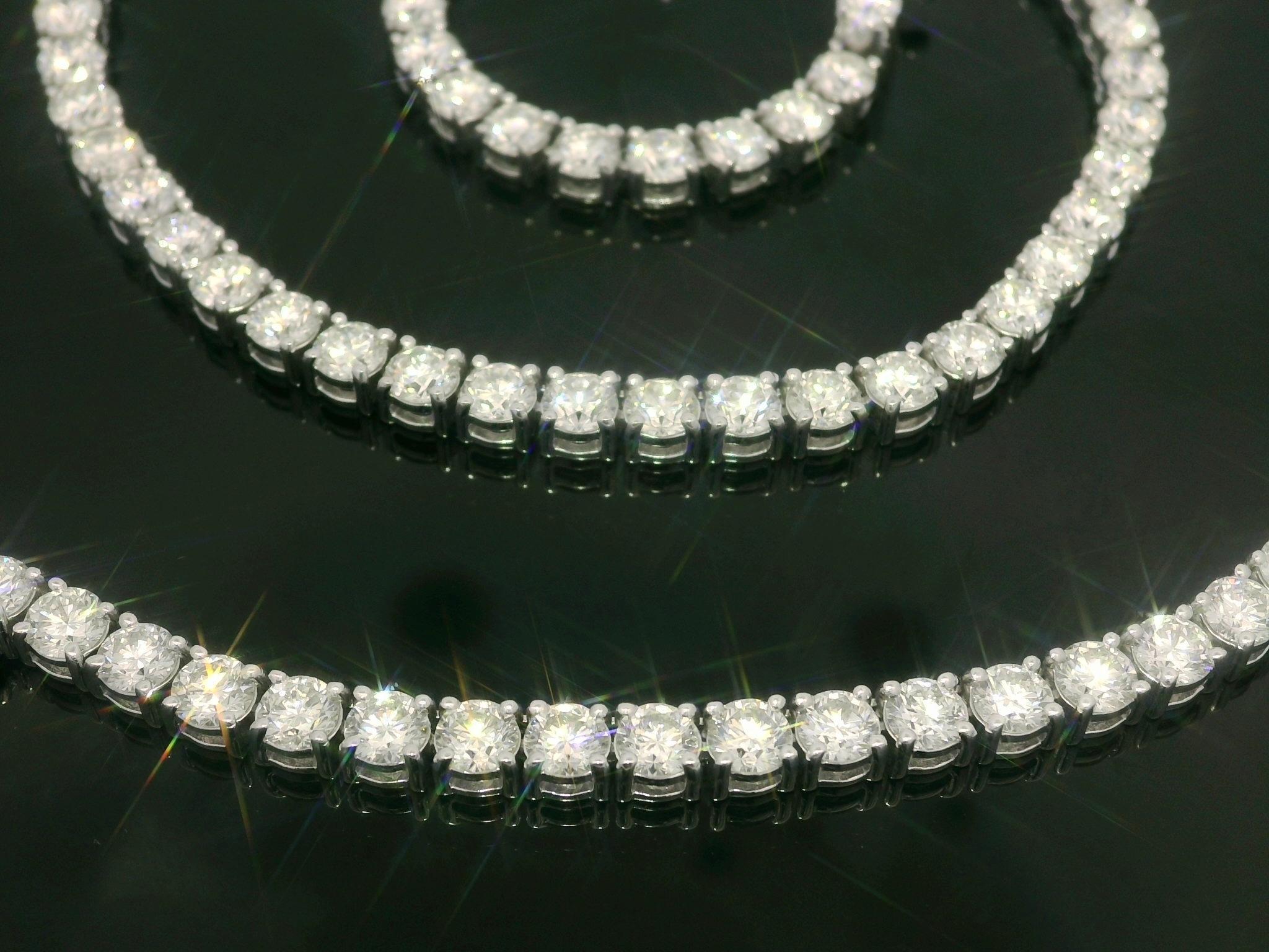 MUST SEE IN PERSON! 

--Stone(s):--
109 Natural Genuine Diamonds - Round Brilliant Cut - Classic 4 Prong Set - H/I Color - VS1/VS2 Clarity - 21.19ctw exact

Material: Solid 14k White Gold
Weight: 28.61 Grams
Chain Type: Tennis Line Link
Chain