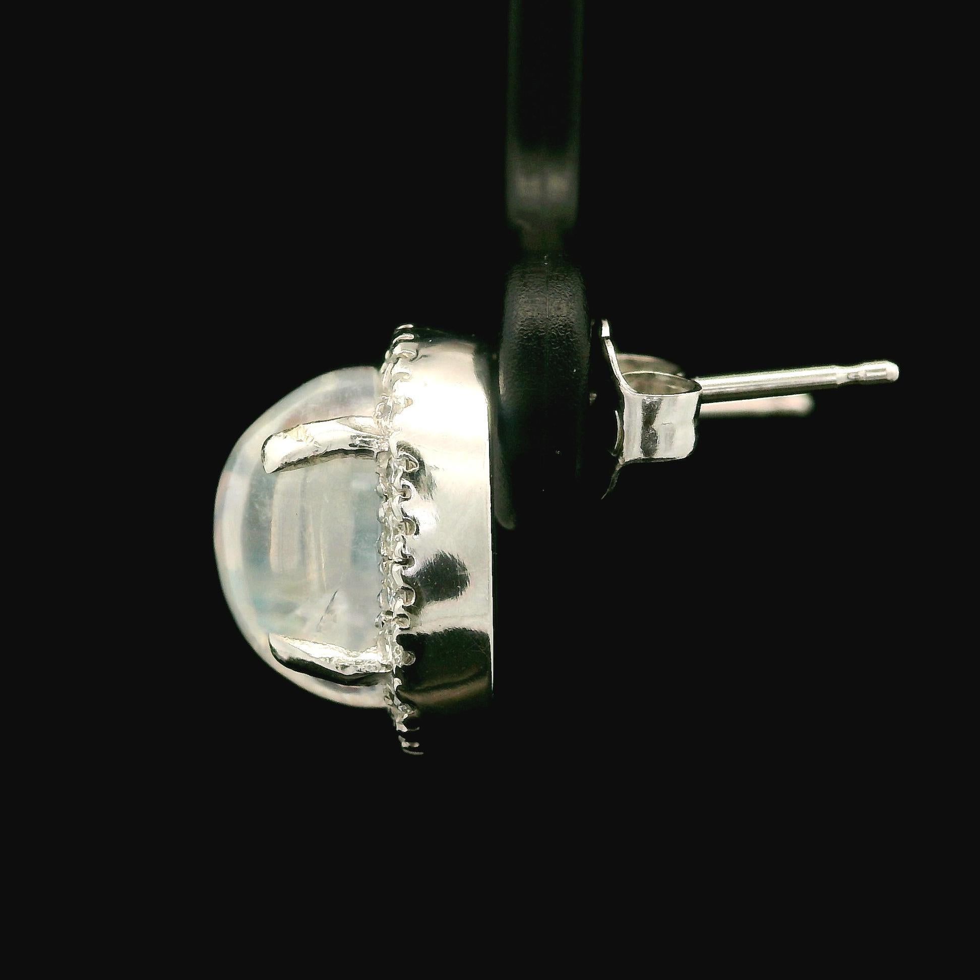 –Stone(s)–
(2) Natural Genuine Moonstone - Oval Cabochon Cut - Prong Set - Translucent of Blue Color w/ Flashes of Rainbow Colors - 9.1x7.1mm - 6.17ctw (exact)
(40) Natural Genuine Diamonds - Round Brilliant - Pave Set - G/H Color - VS1/ VS2 Clarity