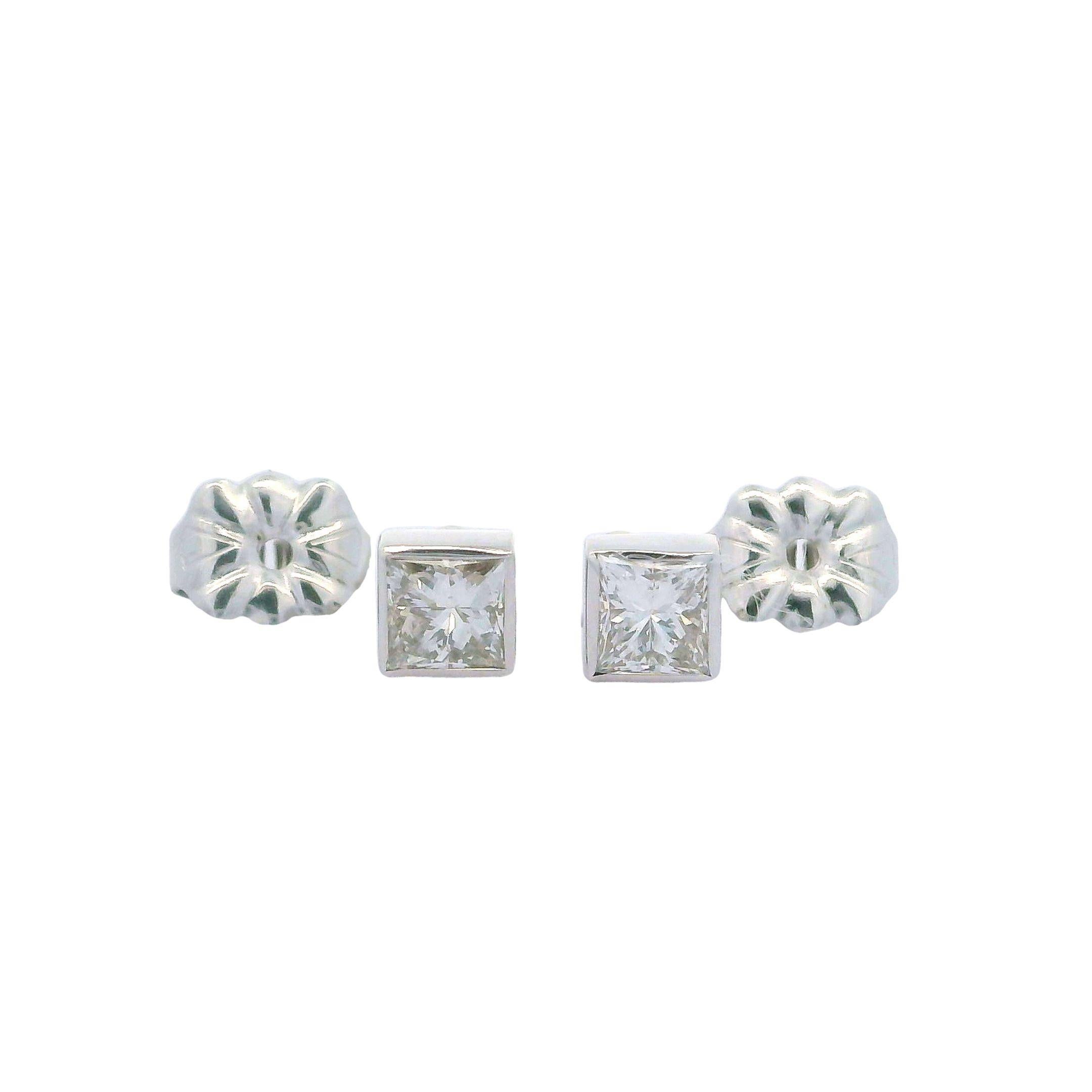 –Stone(s)–
(2) Natural Genuine Diamonds - Princess Cut - Bezel Set - E/F Color - VS1-VS2 Clarity - 0.50ctw (exact)

Material: Solid 14k White Gold
Weight: 0.91 Grams
Backing: Post w/ Butterfly Clasp (Pierced ears are required.)
Overall Dimensions: