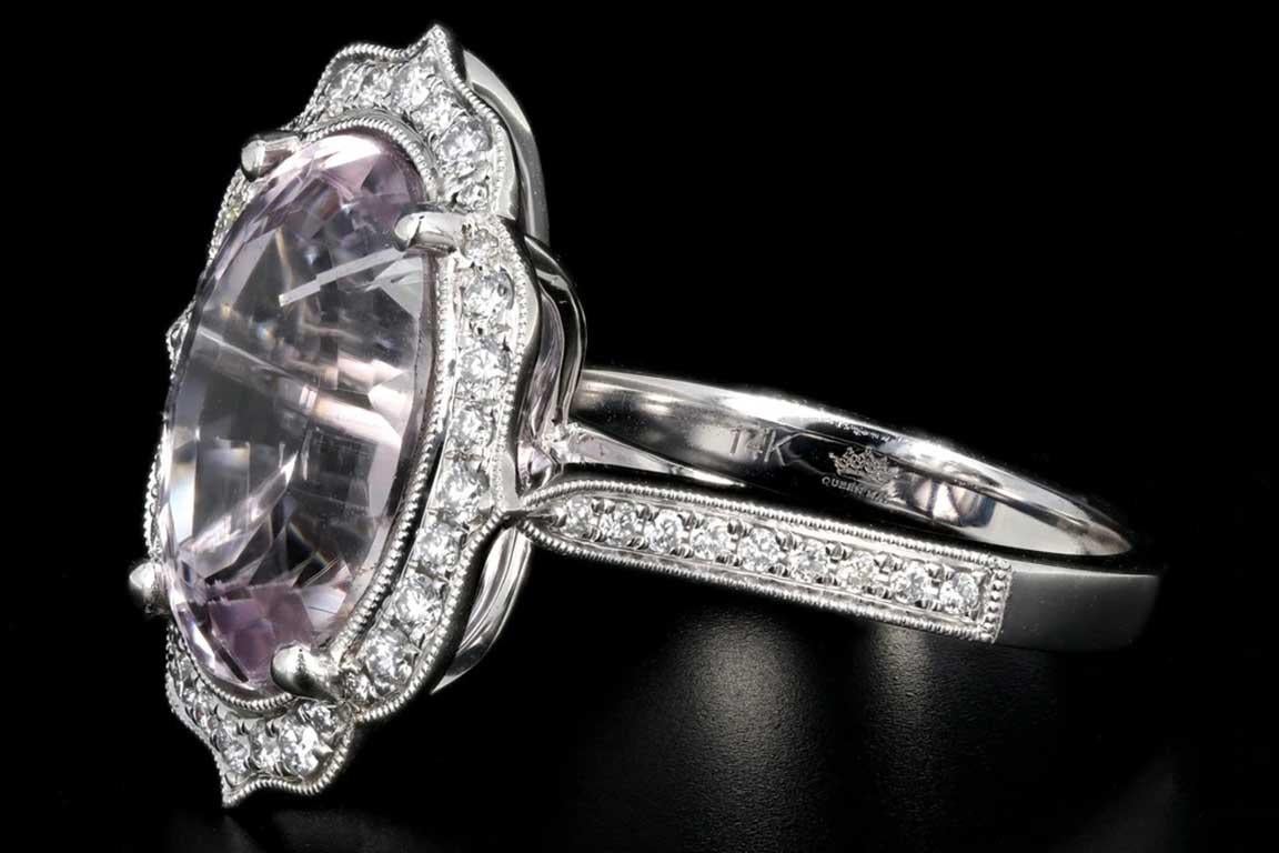 New 14k white gold kunzite and diamond statement ring

Era: New
Designer: Queen May
Composition: 14K white gold
Primary stone: Kunzite
Carat weight: 10.06 carats
Secondary stone: Round brilliant cut diamonds
Carat weight: .48 carats
Color: