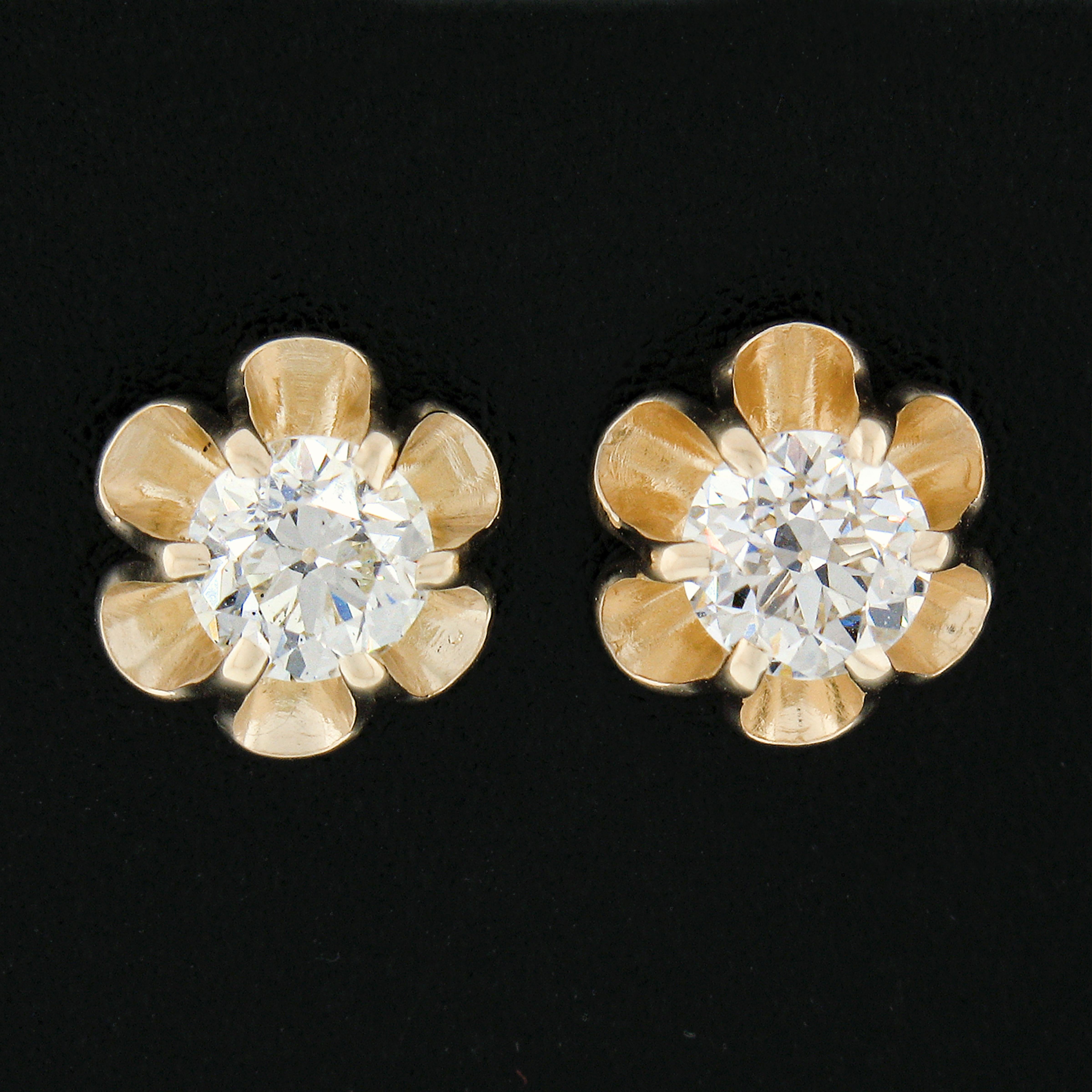 These gorgeous stud earrings are crafted in solid 14k yellow gold and feature, antique, old European cut diamonds that are elegantly set in brand new buttercup prong basket settings. The stunning diamonds total 0.76 carats in weight and are