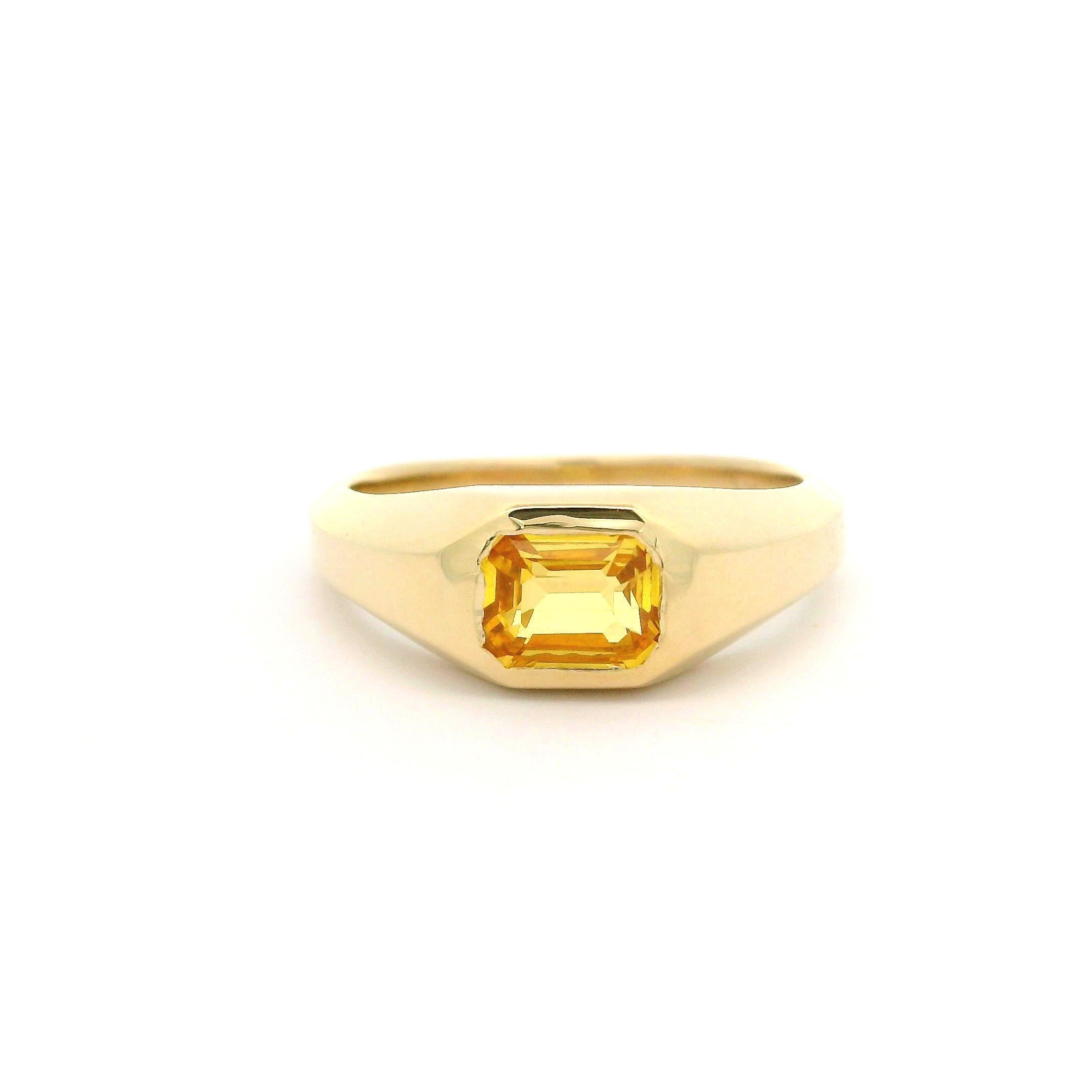 --Stone(s):--
(1) Natural Genuine Sapphire - Emerald Cut - Bezel Set - Deep Yellow Color - 1.12ct (exact)
Total Carat Weight: 1.12 (exact)

Material: Solid 14k Yellow Gold
Weight: 4.59 Grams
Ring Size: 6.5 (Fitted on a finger. We can custom size