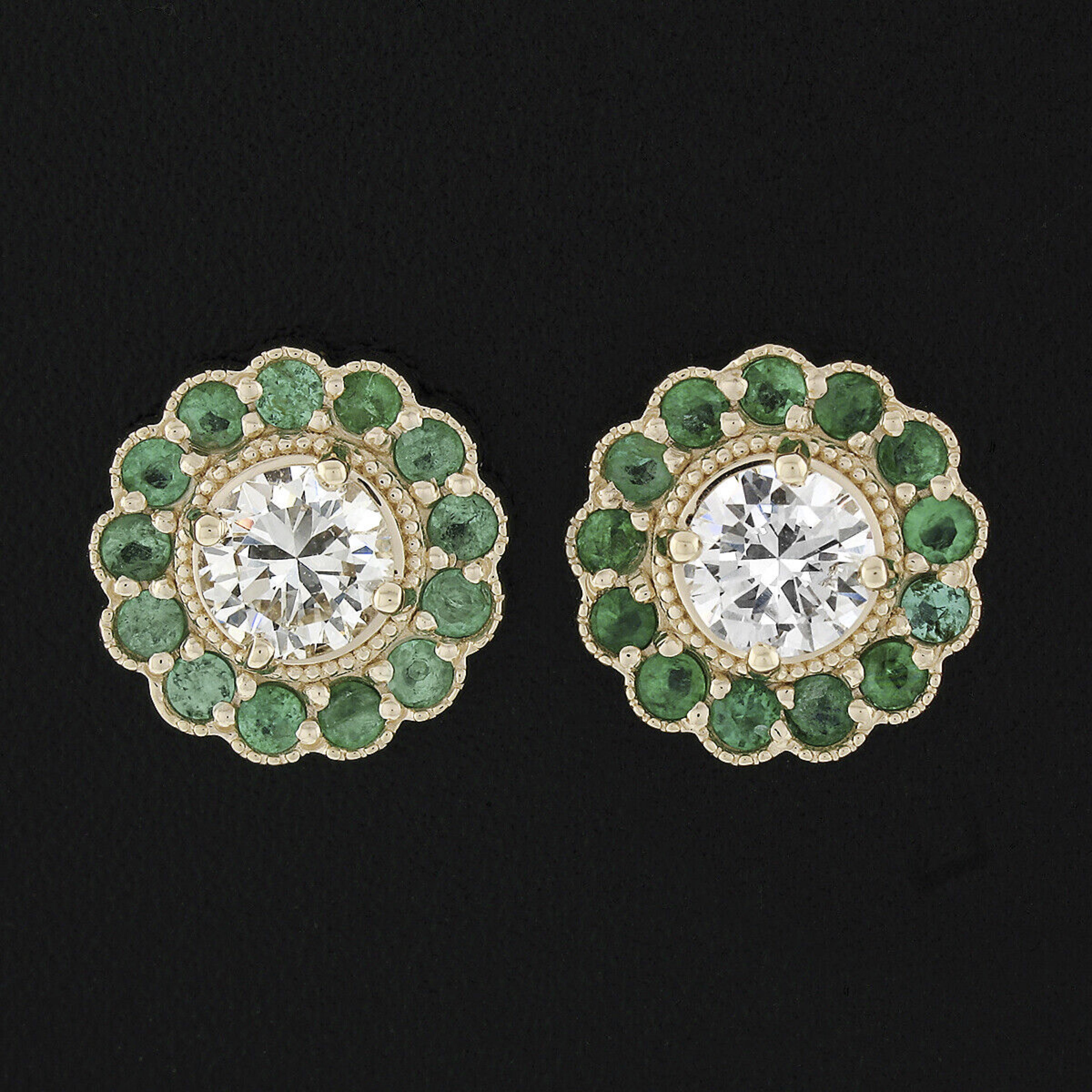 This is an absolutely gorgeous pair of diamond and emerald cluster flower earrings that very well crafted in solid 14k yellow gold. Each earring features a round brilliant prong set diamond at its center with a halo of very attractive and beautiful