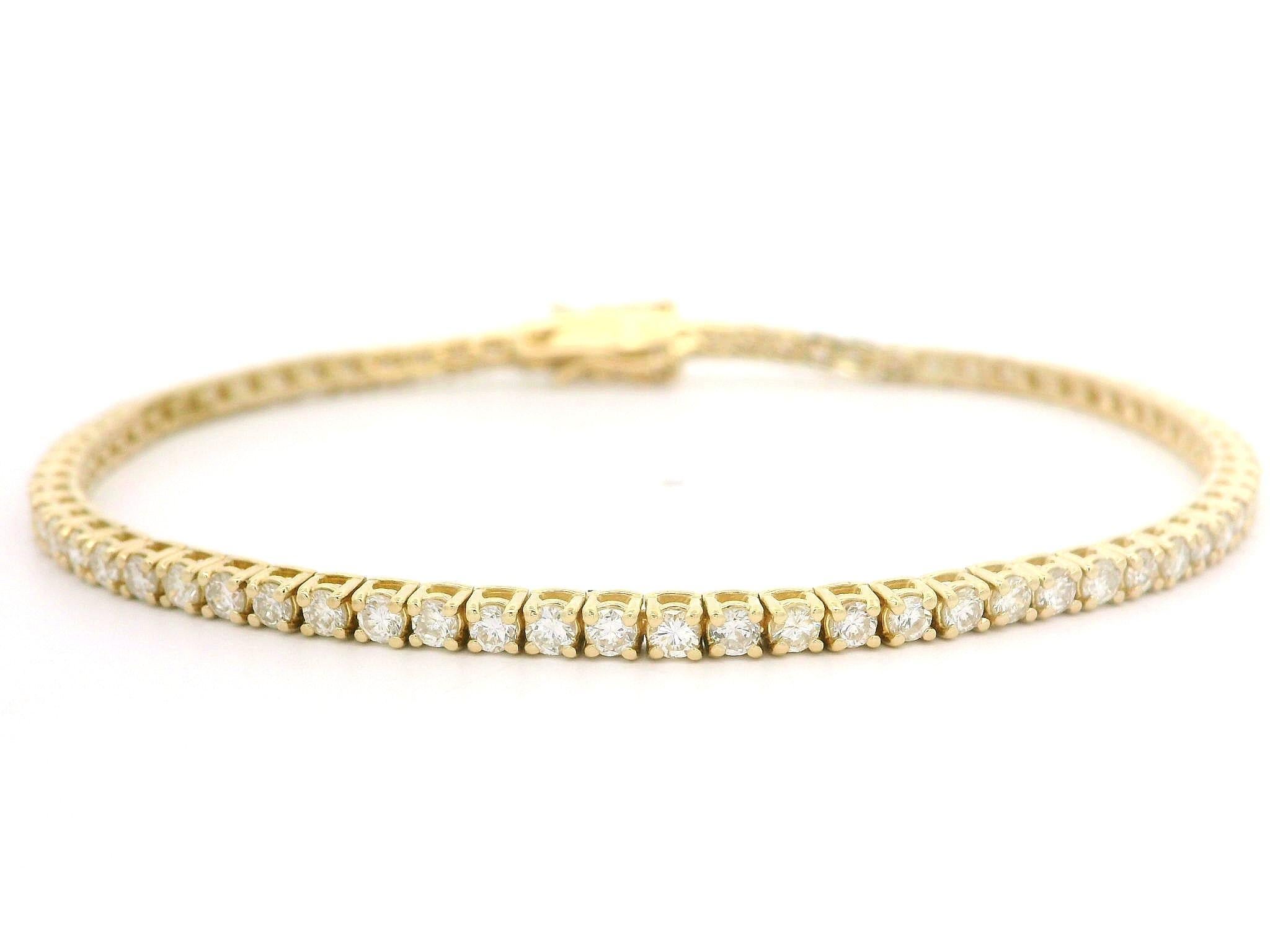 –Stone(s)–
(73) Natural Genuine Diamonds - Round Brilliant Cut - Prong Set - G/H Color - SI1/SI2 Clarity - 2.65ctw (exact)

Material: Solid 14k Yellow Gold
Weight: 6.99 Grams
Type: Line Link Tennis
Length: Measures 7.0” Next to a Ruler, Will