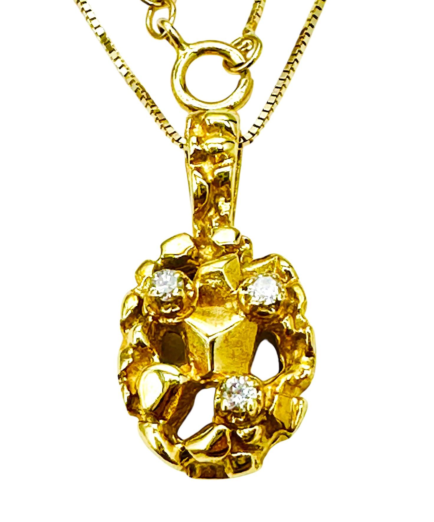 This is a beautiful handmade 14k gold nuggest pendant with three 2 mm brilliant cut diamonds.  The pendant is stamped 