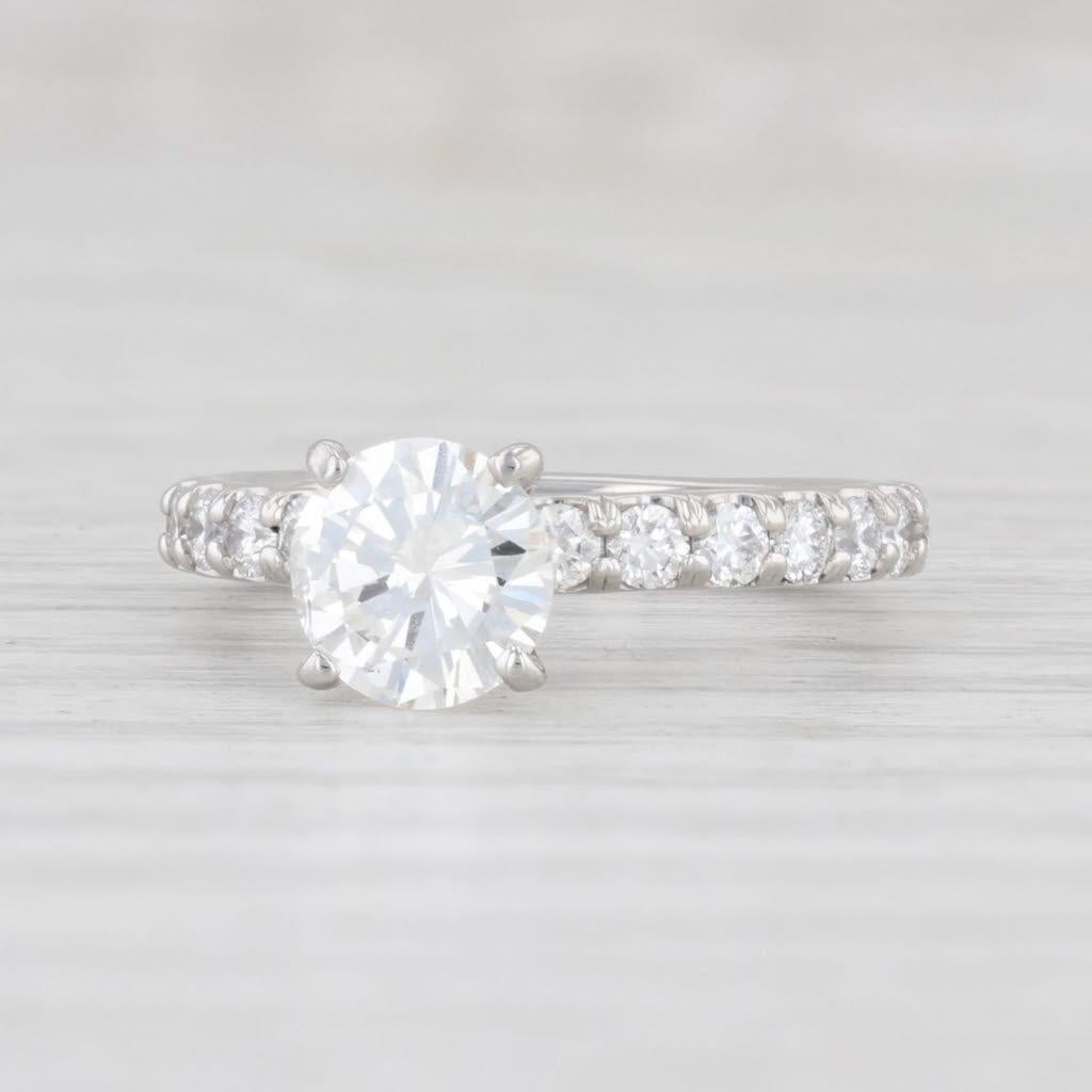 The center diamond of this beautiful solitaire with accents ring is GIA certified, the GIA certificate of which is included with the purchase of the ring.

Gem: Natural Diamonds - 1.51 Total Carats
- Center - 1.01 Carats (6.3 - 6.5 mm), Round