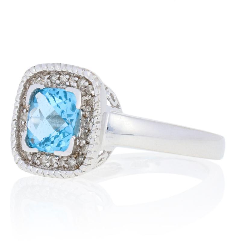 Treat yourself to something sweet with this stunning NEW blue topaz and diamond cocktail ring! Composed of glistening 14k white gold, this ring showcases a 1.55 carat total weight genuine blue topaz solitaire that is elegantly framed by a shimmering