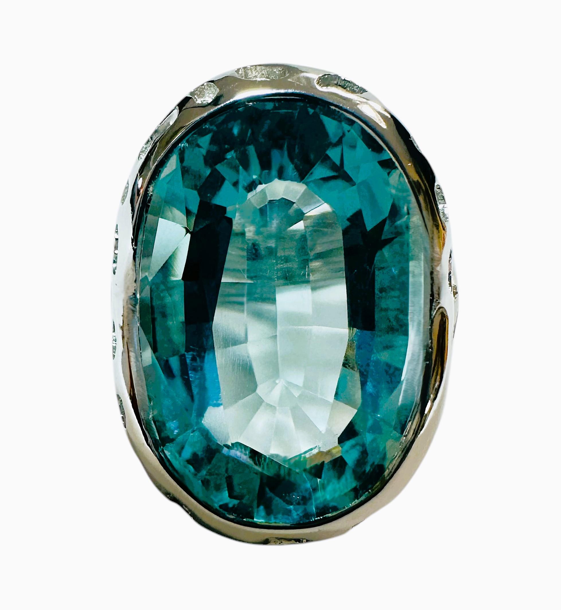 The stone is from Brazil and is just exquisite. The stone is an Elysian Ocean Blue Aquamarine and is 17.02 carats.  The stone is a fancy oval cut stone and measures 21 x 14 mm and is placed in a beautiful filigree sterling setting.  The ring is a