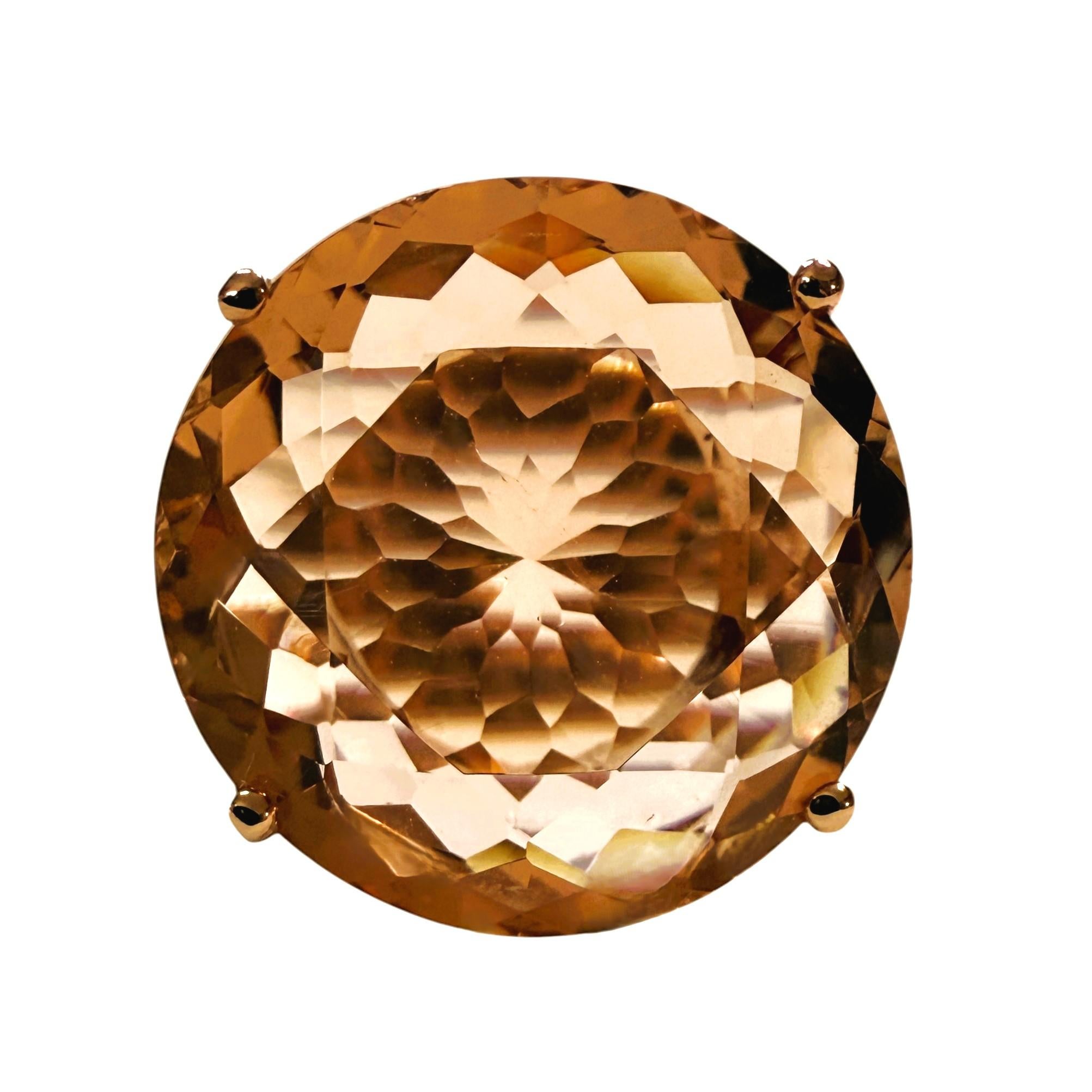 The cut of this stone and design of this ring is just phenomenal. The ring is a size 6.5.   The stone is from Nigeria and is just exquisite.  It is a very high-quality stone.  It is a fancy round cut stone and is 18.3 Cts   The main stone is 19.7 mm