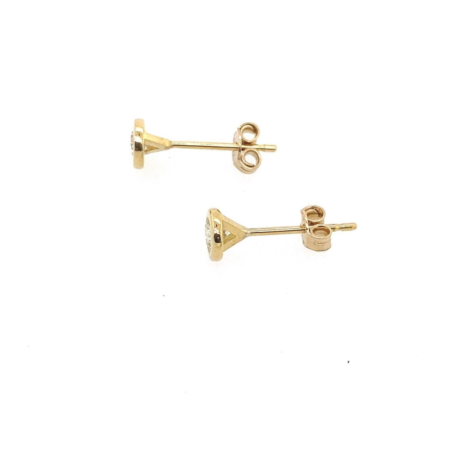 These 18ct Yellow Gold stud earrings are set  in a rubover setting and have a total Diamond weight of 0.20ct, for the ultimate in sparkle and shine.

Additional Information:
Total Diamond Weight: 0.20ct
Diamond Colour: H
Diamond Clarity: SI2
Total
