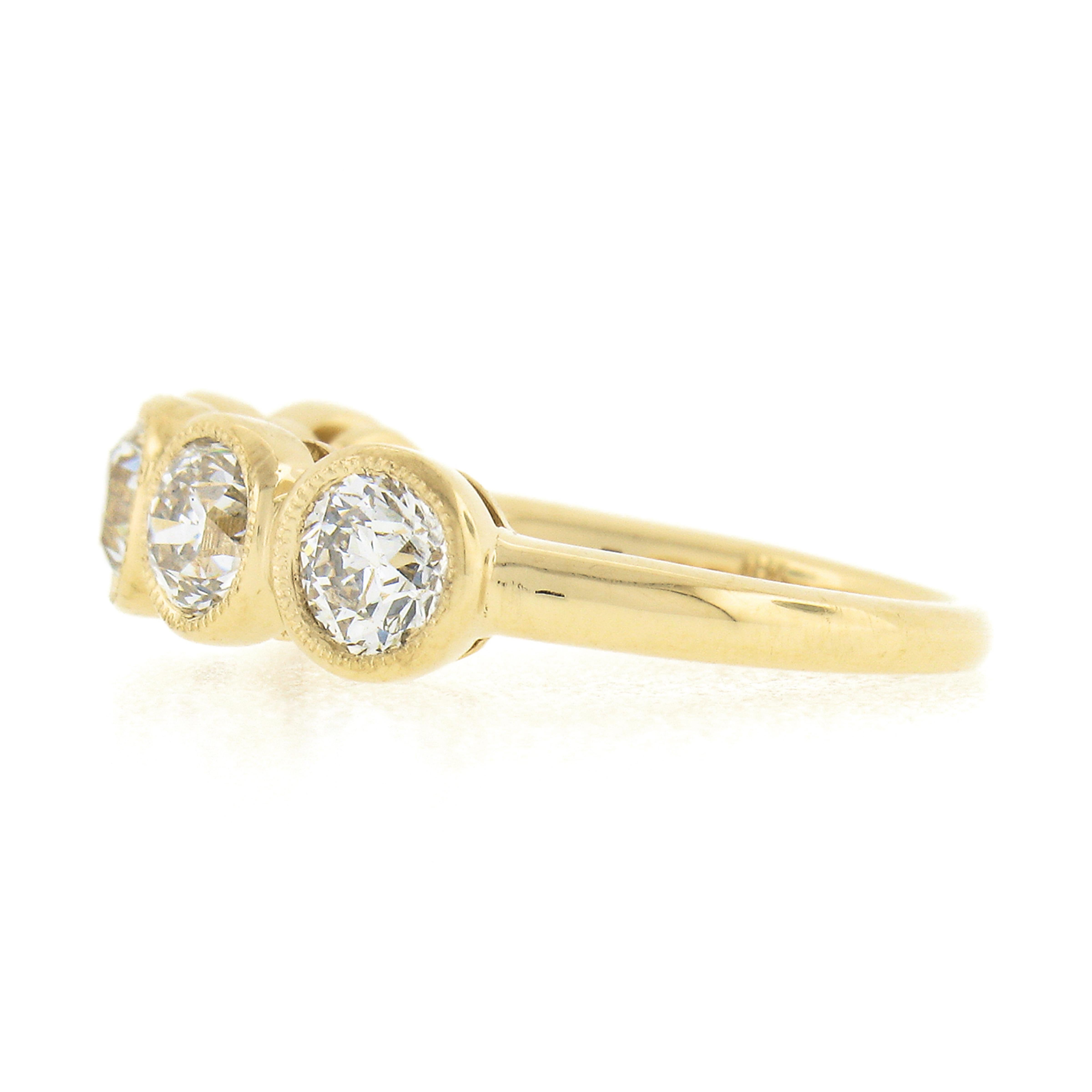 This magnificent diamond band ring was newly crafted from solid 18k yellow gold and features 5 old European cut diamonds neatly bezel set with delicate milgrain etching across its top. Each of these fiery diamond shows a very nice large size,