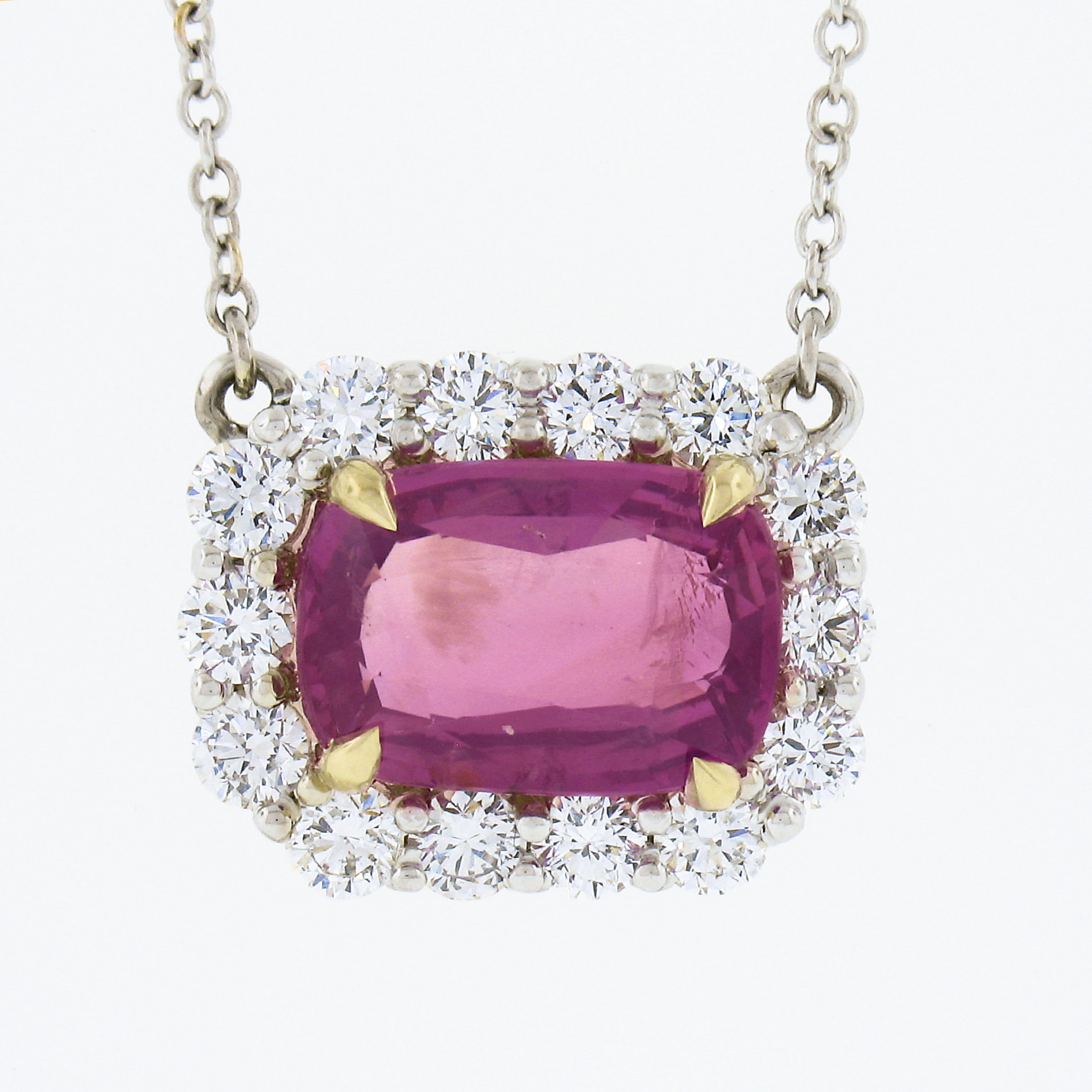 Here we have a gorgeous, brand new and custom made pendant necklace crafted in solid 18k white gold and features a very fine, GIA certified, cushion brilliant cut pink sapphire solitaire neatly set in yellow gold at the center, in which is further