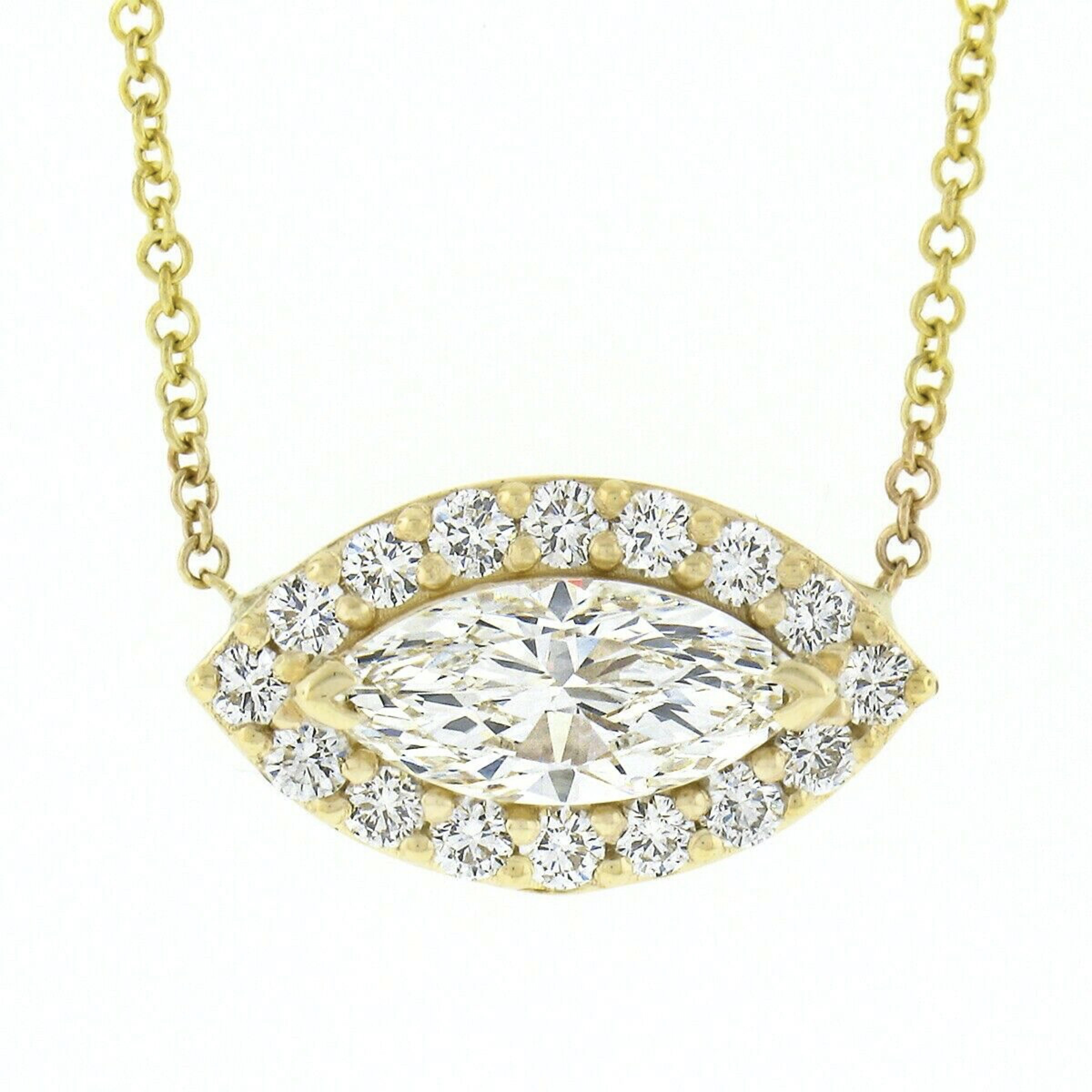 Here we have a gorgeous, brand new, pendant necklace crafted in solid 18k yellow gold. The necklace features an outstanding evil eye design constructed from a very fine marquise brilliant cut diamond solitaire neatly set at the center in which is
