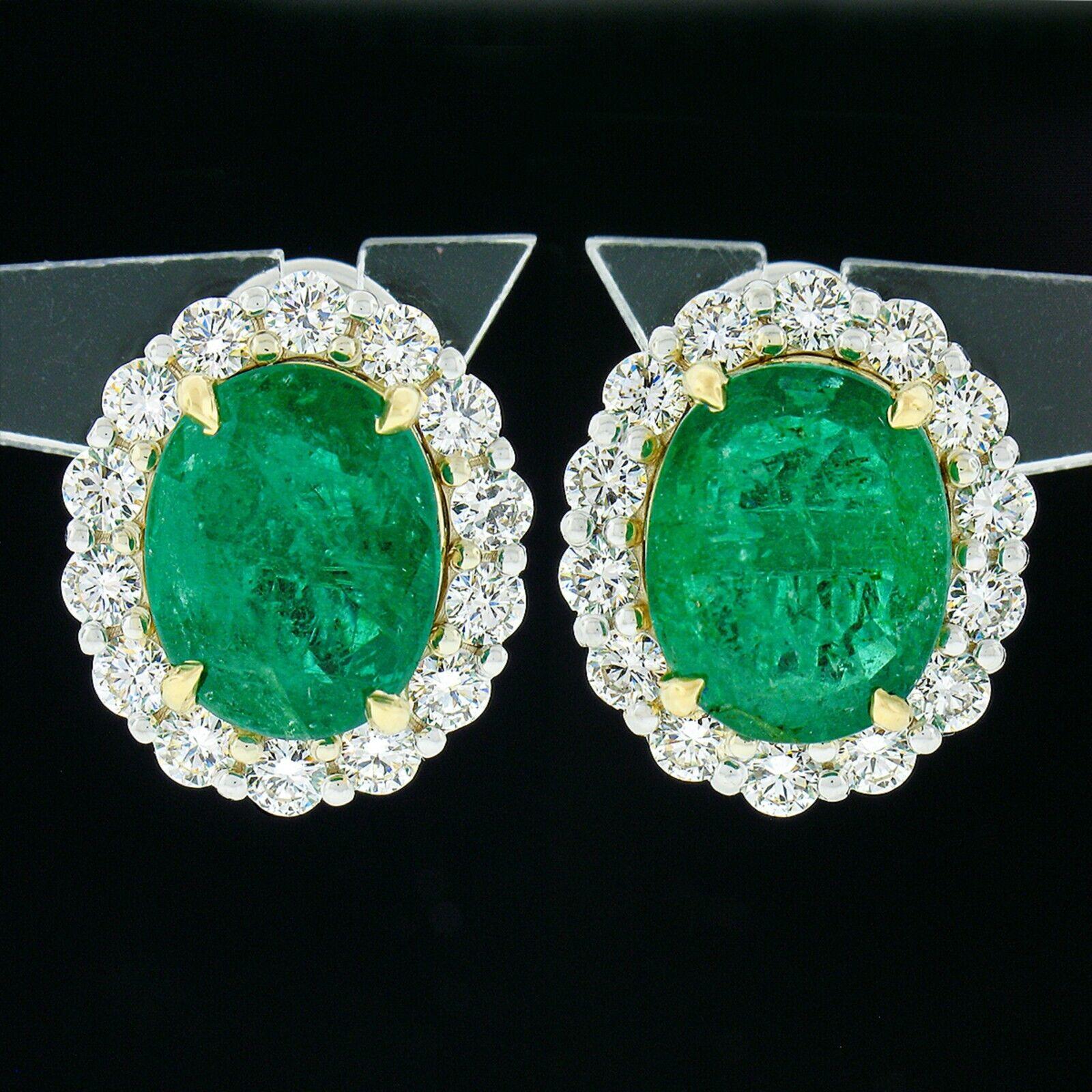 You are looking at a truly breathtaking pair of earrings that are newly crafted from 18k solid white gold with a yellow gold center basket that features a large, GIA certified, oval brilliant cut emerald in which together total an incredible 10.78
