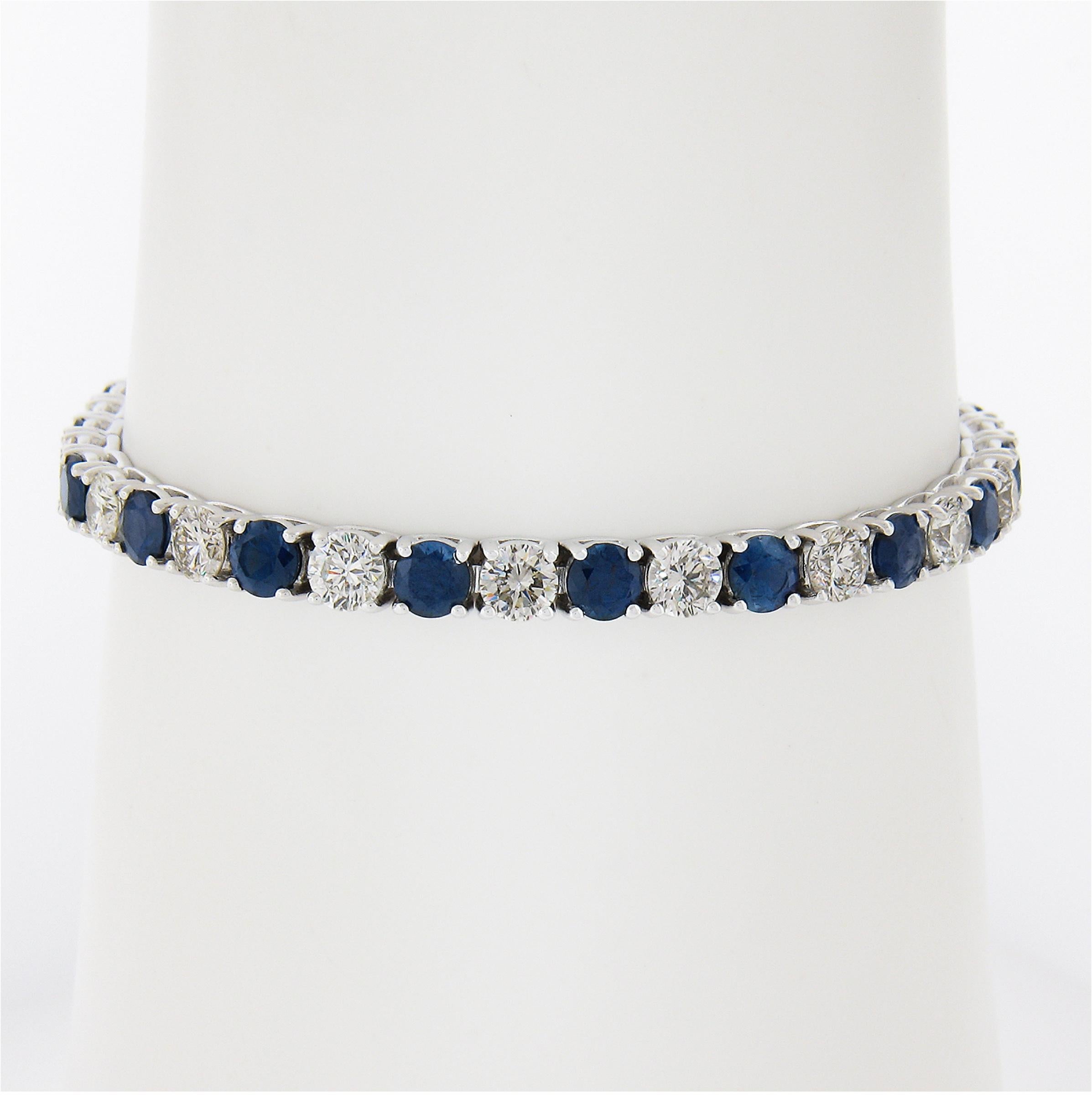 Here we have a breathtaking new bracelet crafted from solid 18k white gold and features alternating diamonds and sapphires in a straight line design. The diamonds are large round brilliant cut stones totaling exactly 5.31 carats in weight. These