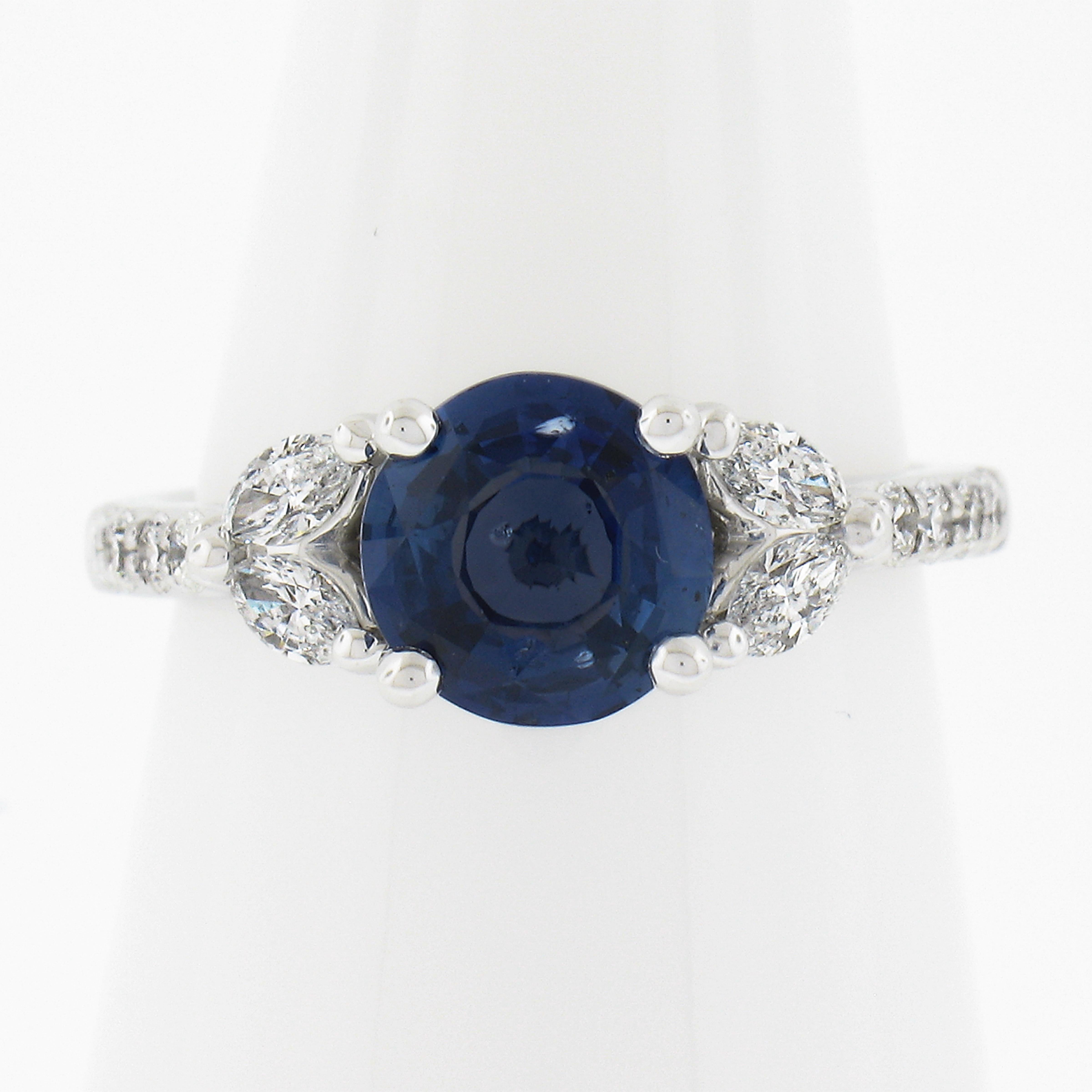 --Stone(s):--
(1) Natural Genuine Sapphire - Round Brilliant Cut - Prong Set - Very Nice Clean Blue Color - No Heat - 2.03ct (exact - certified)
** See Certification Details Below for Complete Info **
(16) Natural Genuine Diamonds - 12 Round