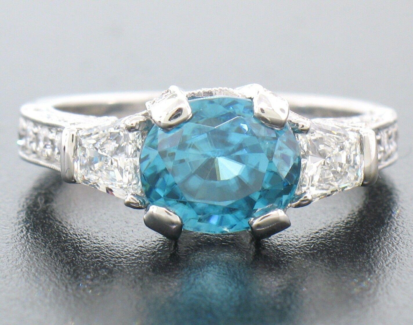18k White Gold 2.50ct Oval Brilliant Blue Zircon & Trapezoid Diamond Ring In New Condition For Sale In Montclair, NJ