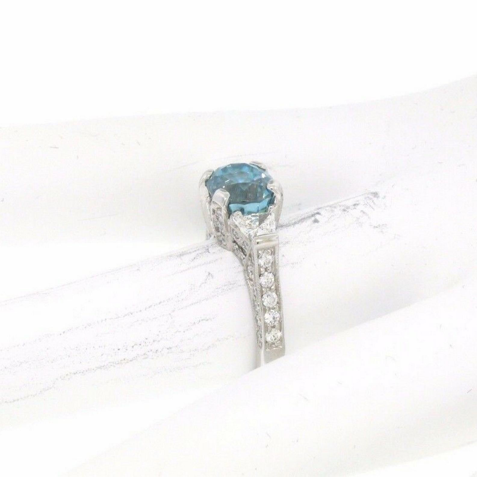18k White Gold 2.50ct Oval Brilliant Blue Zircon & Trapezoid Diamond Ring For Sale 3