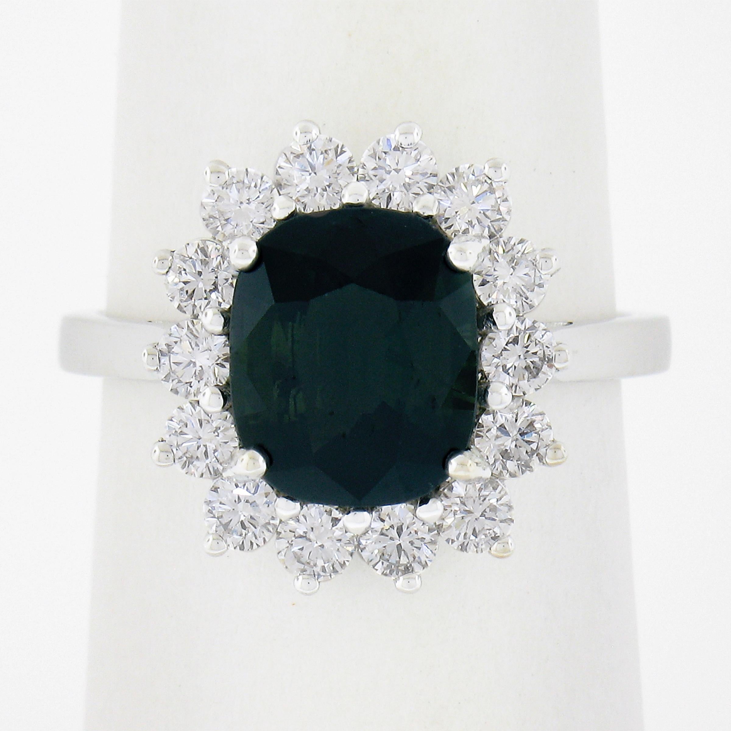 A magnificent well cut green sapphire with super brilliant round brilliants framing the sapphire. Custom made around the shape of the sapphire. The contrast between the white diamonds and rich color of the sapphire create a masterpiece that attracts