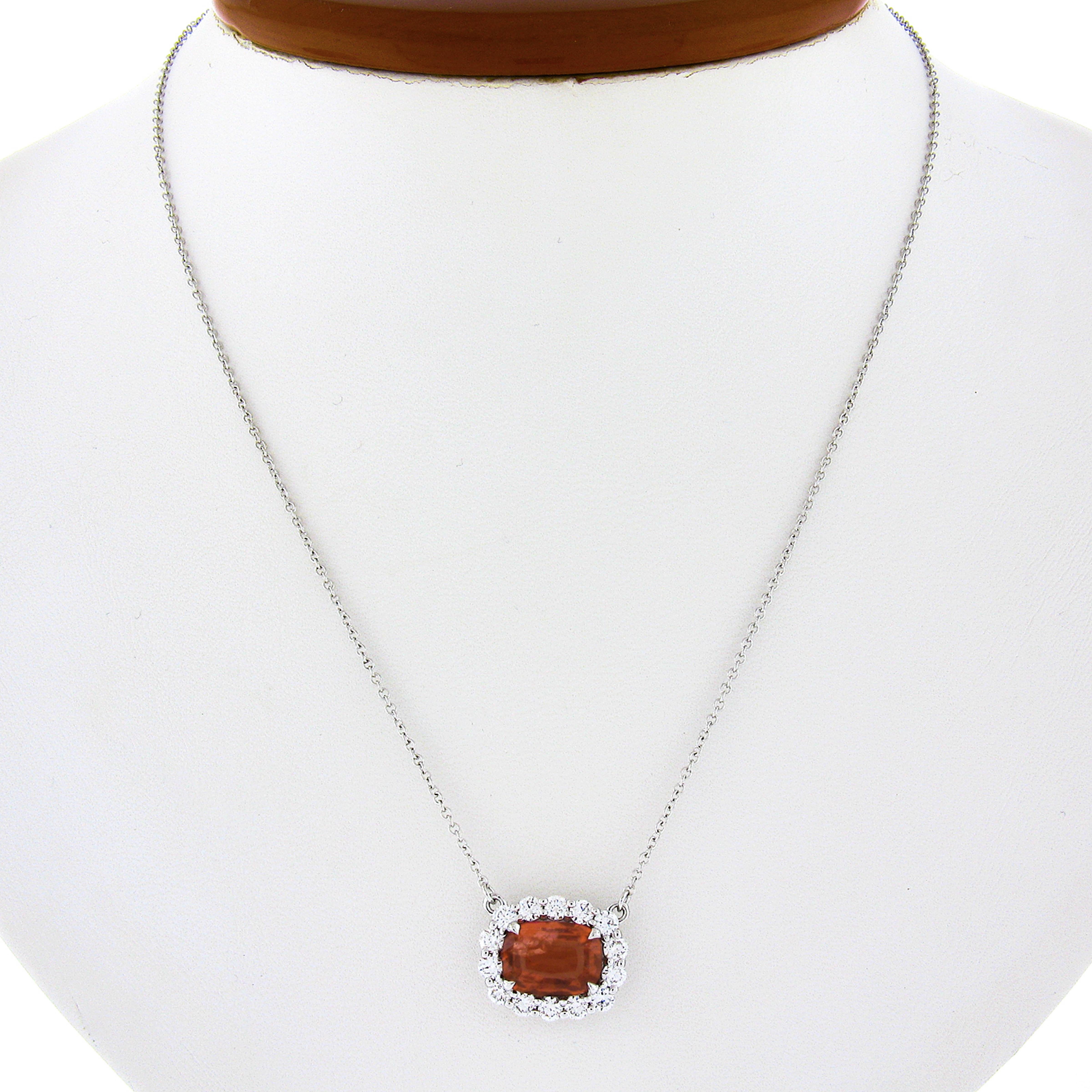 Here we have a gorgeous, brand new and custom made pendant necklace crafted in solid 18k white gold and features a very fine, GIA certified, cushion brilliant cut spinel solitaire neatly prong set at the center in which is further surrounded by a