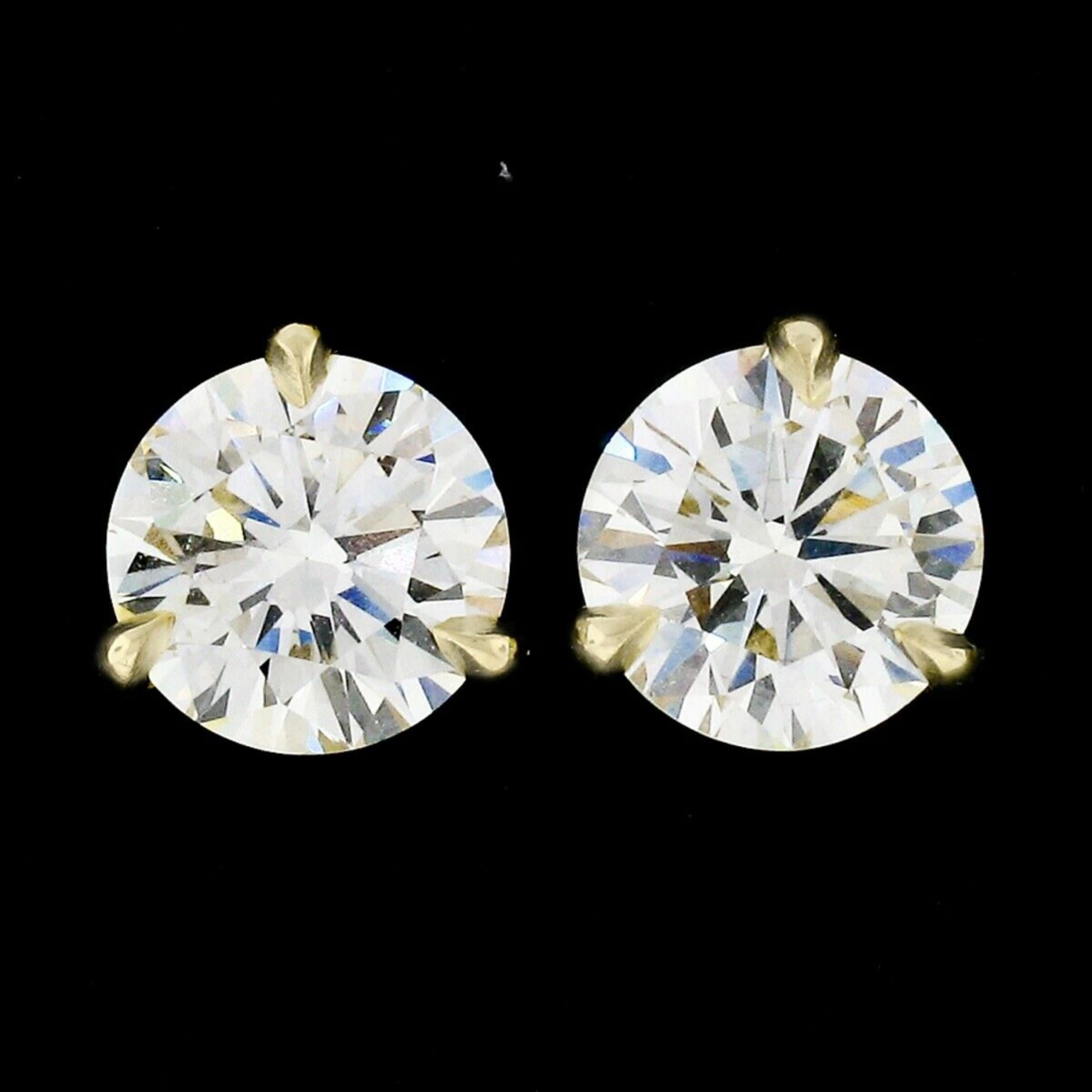 Here we have a stunning pair of large diamond stud earrings which are newly and very well crafted in solid 18k yellow gold. The earrings feature 2 gorgeous, fine quality diamonds having near colorless K/L color, with super clean VVS2/VS1 clarity,